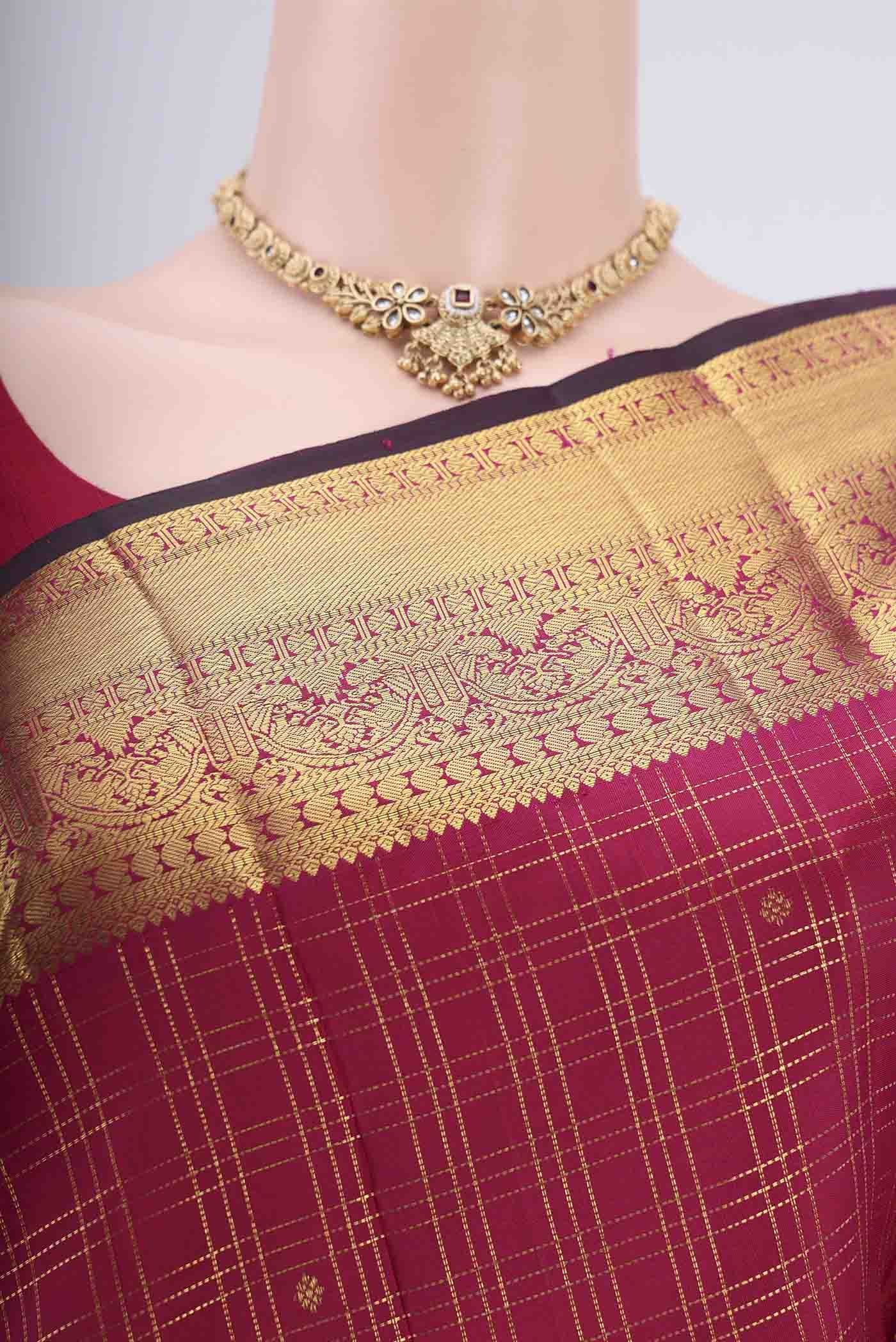 Border image of Maroon Dual Tone Kanjivaram Silk Saree with Checked design on the body and Zari Border. 