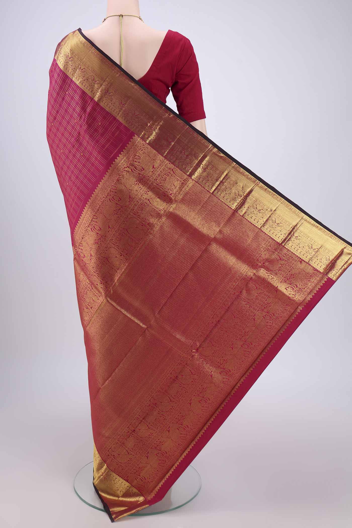 Flat view of Maroon Dual Tone Kanjivaram Silk Saree with Checked design on the body and Zari Border. 