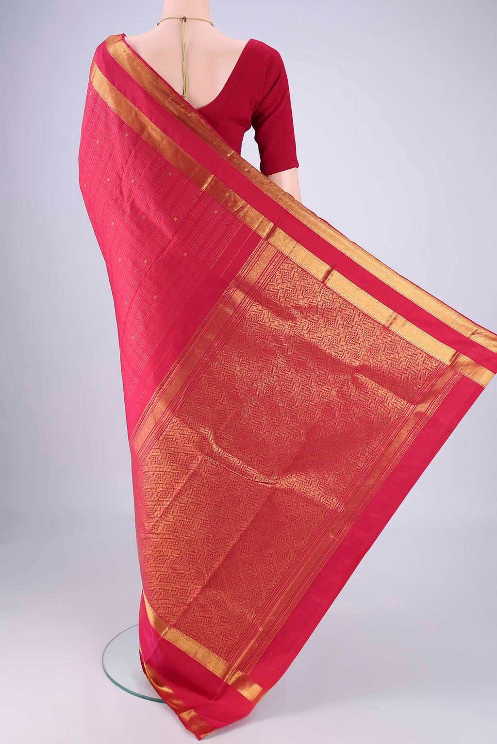 Flat view of Dark Pink Kanjivaram Silk Saree with Checked design on the body and Zari Border. 