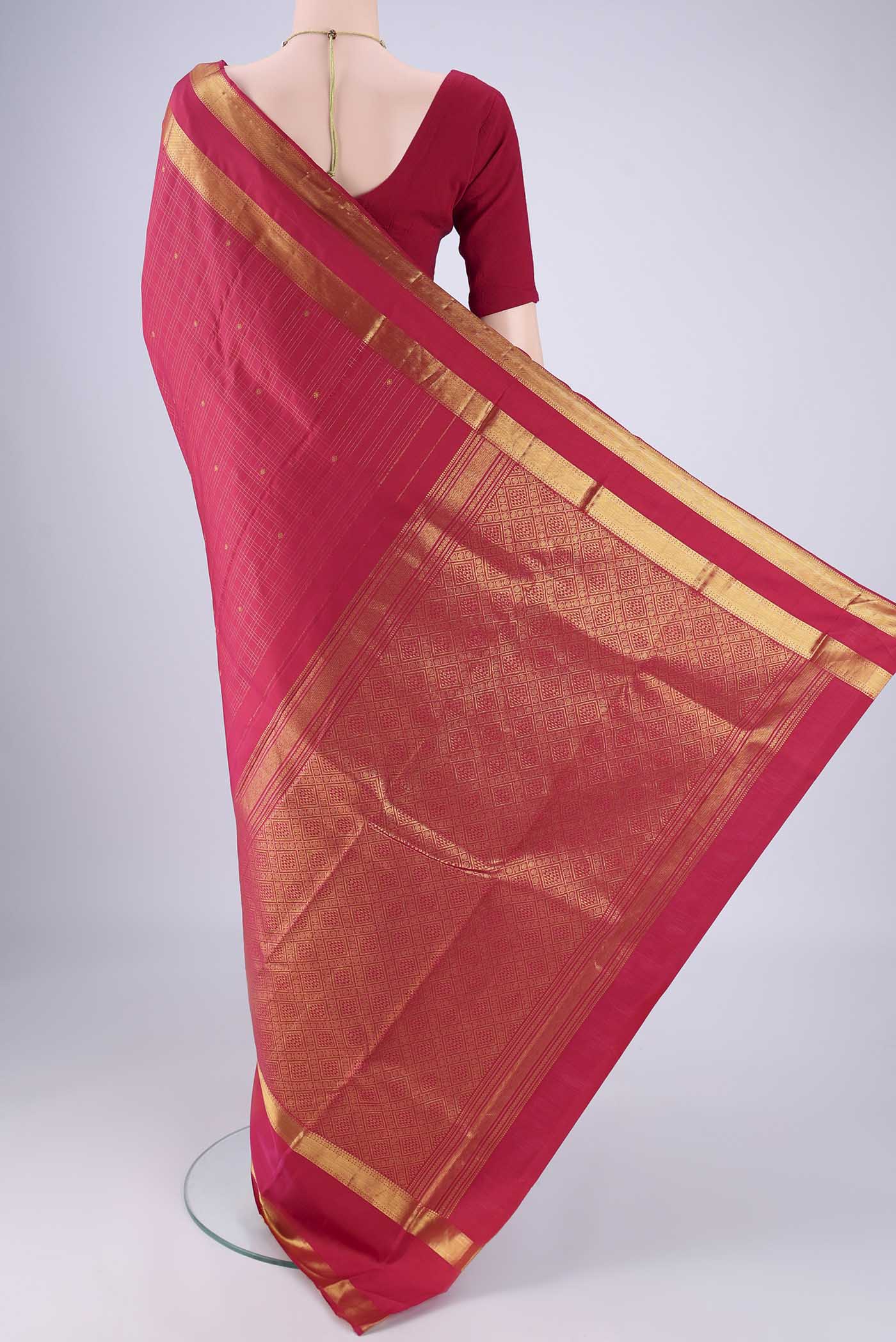 Flat view of Dark Pink Kanjivaram Silk Saree with Checked design on the body and Zari Border. 