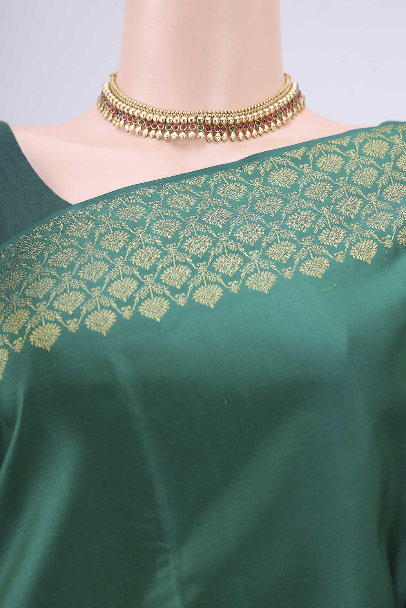 Border image of Bottle Green Kanjivaram Silk Saree with Plain Body and Zari Border. 