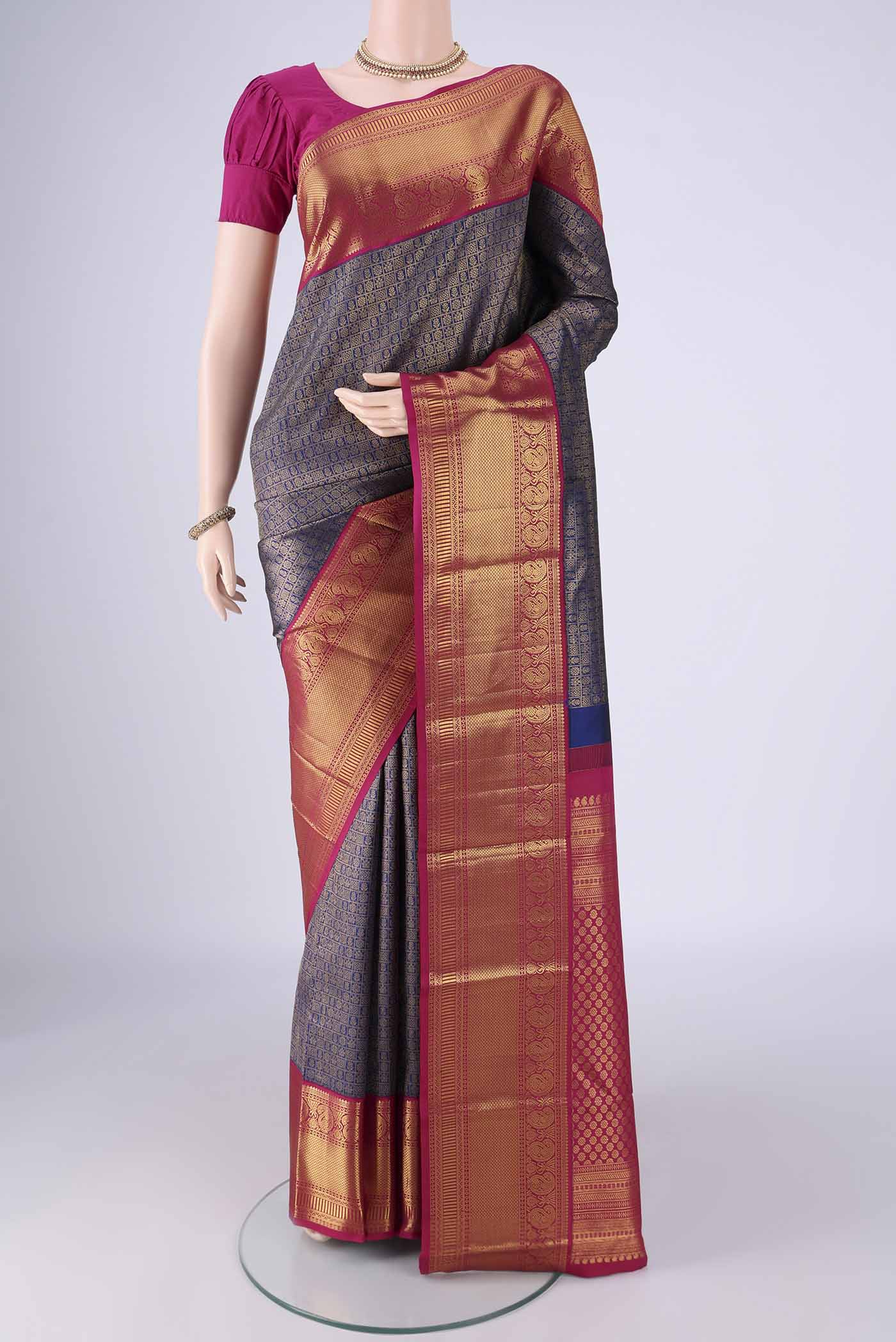 Blue Kanjivaram Silk Saree with Zari Brocade on the body and Zari Border.  displayed on a mannequin