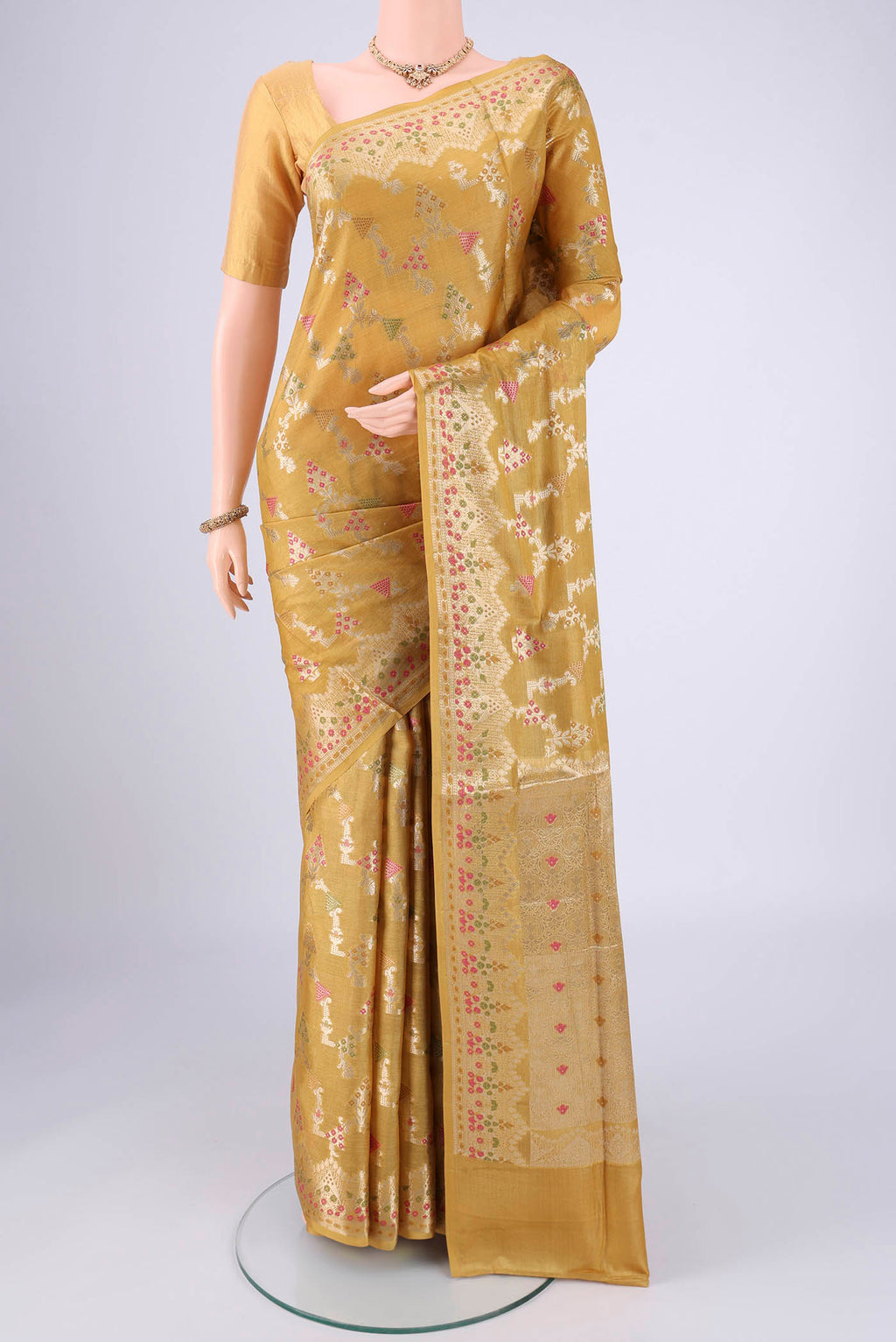 Yellow Banarasi Tussar Silk Saree with Zari Brocade on the body and Zari And Thread Border.  displayed on a mannequin
