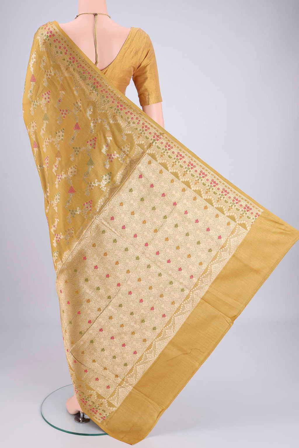 Flat view of Yellow Banarasi Tussar Silk Saree with Zari Brocade on the body and Zari And Thread Border. 