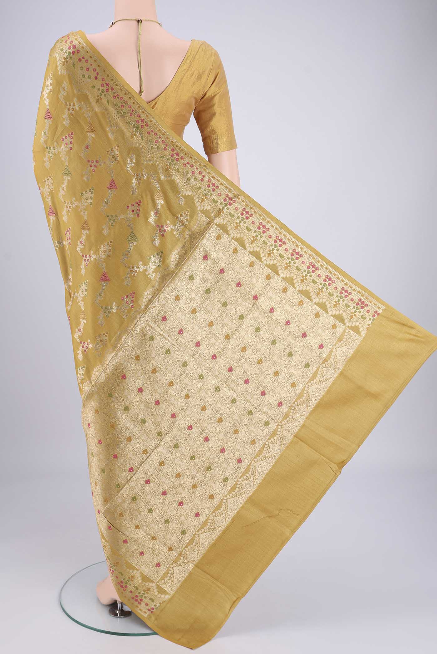 Flat view of Yellow Banarasi Tussar Silk Saree with Zari Brocade on the body and Zari And Thread Border. 