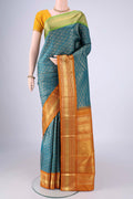 Pure Silk Pure Zari Teal Kanjivaram Saree with Zari Brocade on the body and Ganga Jamuna Border.  displayed on a mannequin