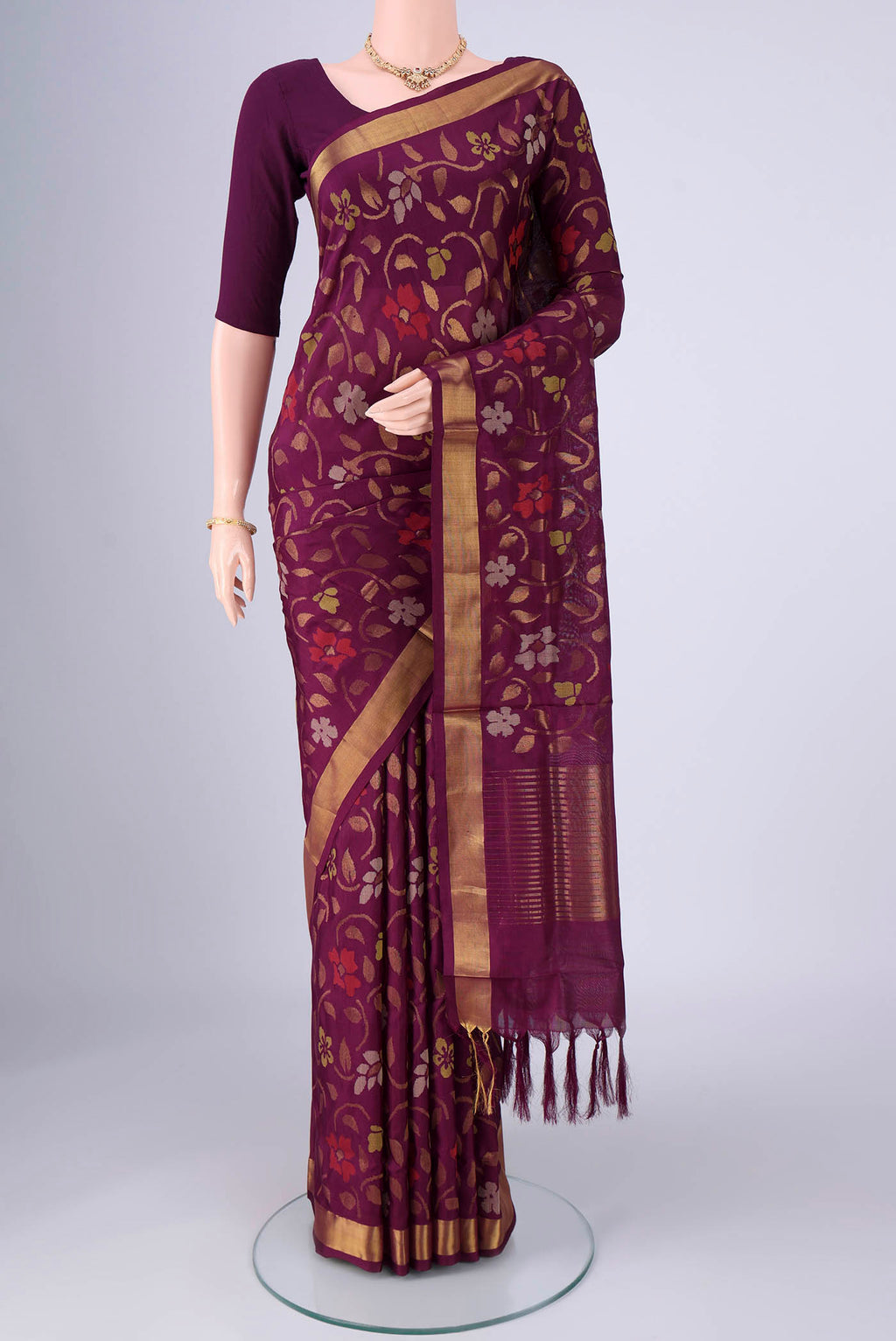 Pure Silk Pure Zari Burgundy Uppada Saree with Jamdani on the body and Zari Border.  displayed on a mannequin