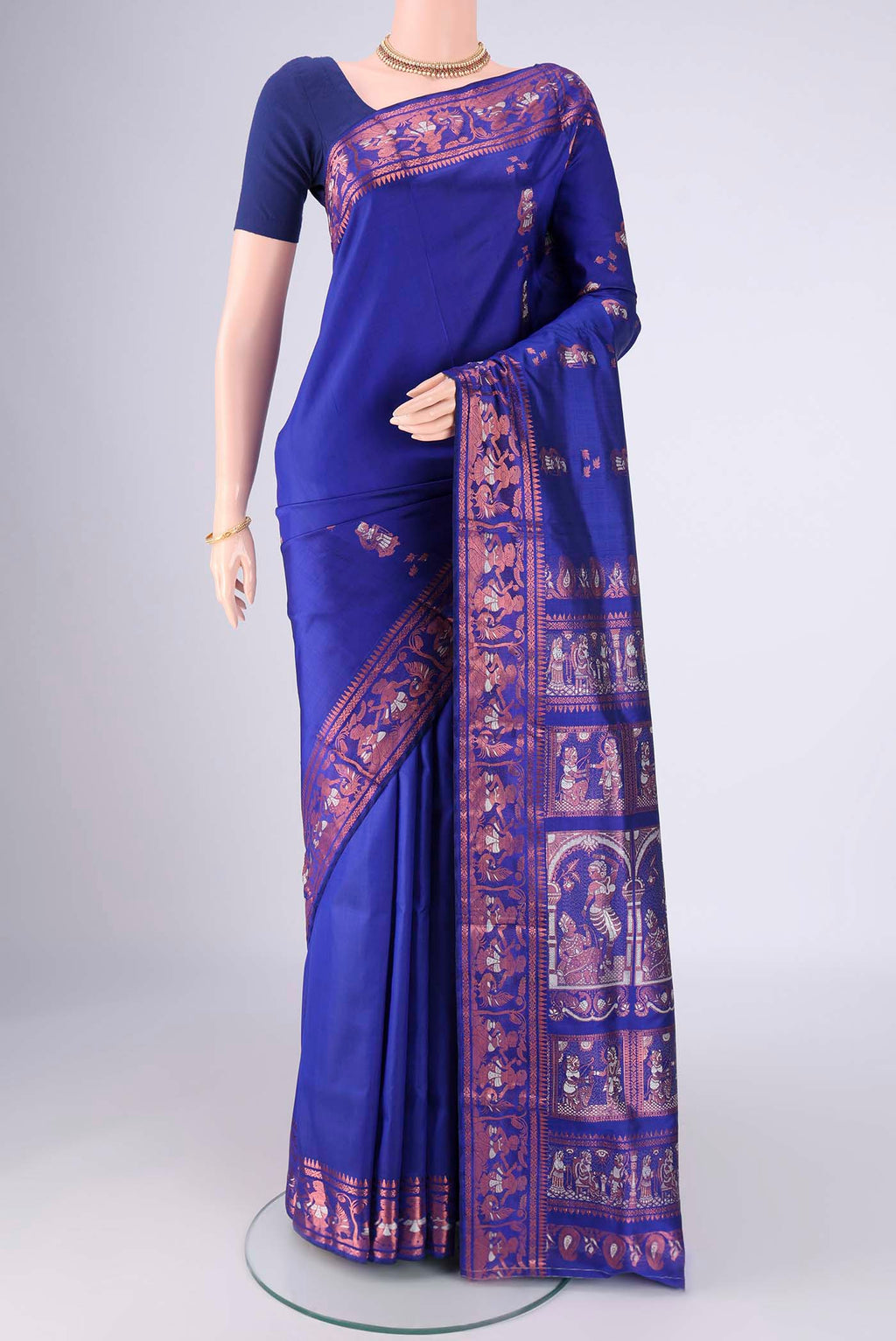 Royal Blue Baluchari Silk Saree with Zari And Thread Butta on the body and Zari And Thread Border.  displayed on a mannequin