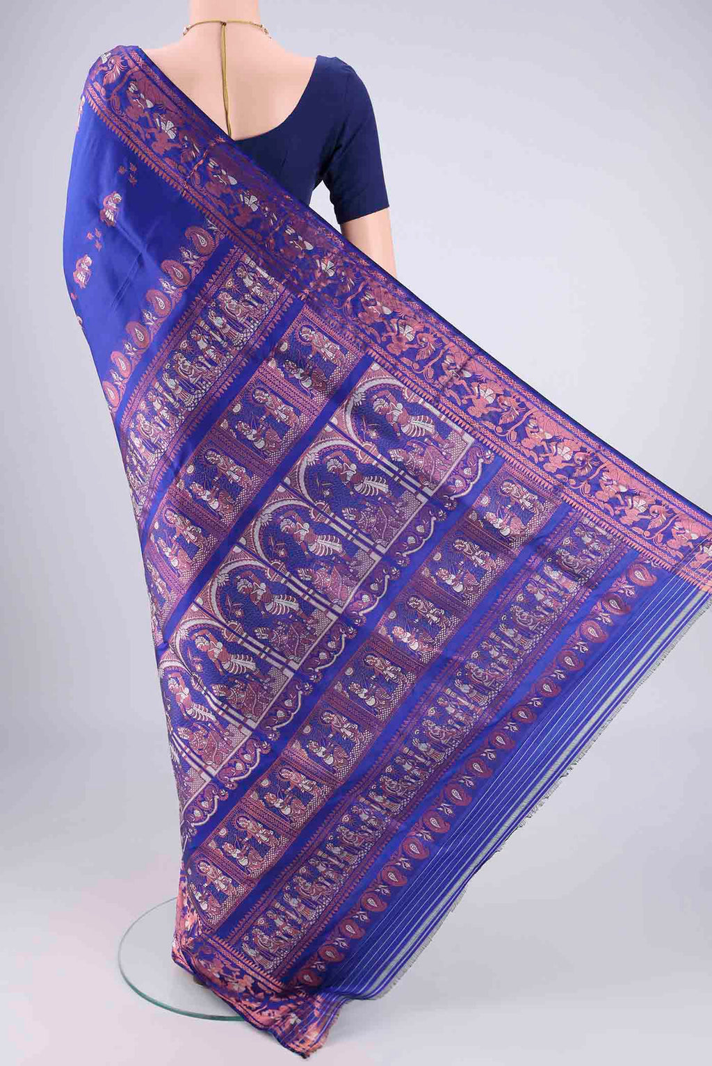 Flat view of Royal Blue Baluchari Silk Saree with Zari And Thread Butta on the body and Zari And Thread Border. 