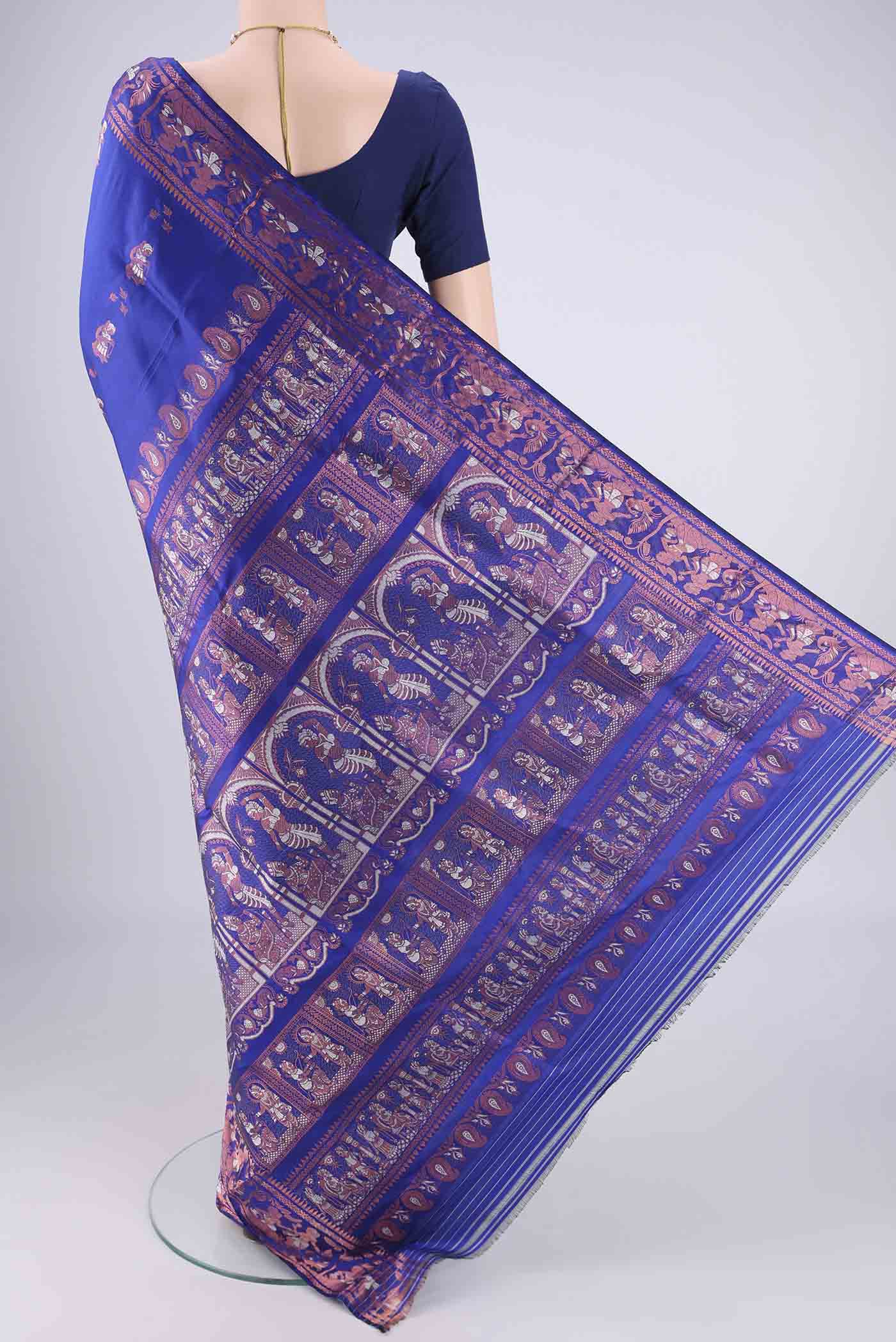 Flat view of Royal Blue Baluchari Silk Saree with Zari And Thread Butta on the body and Zari And Thread Border. 
