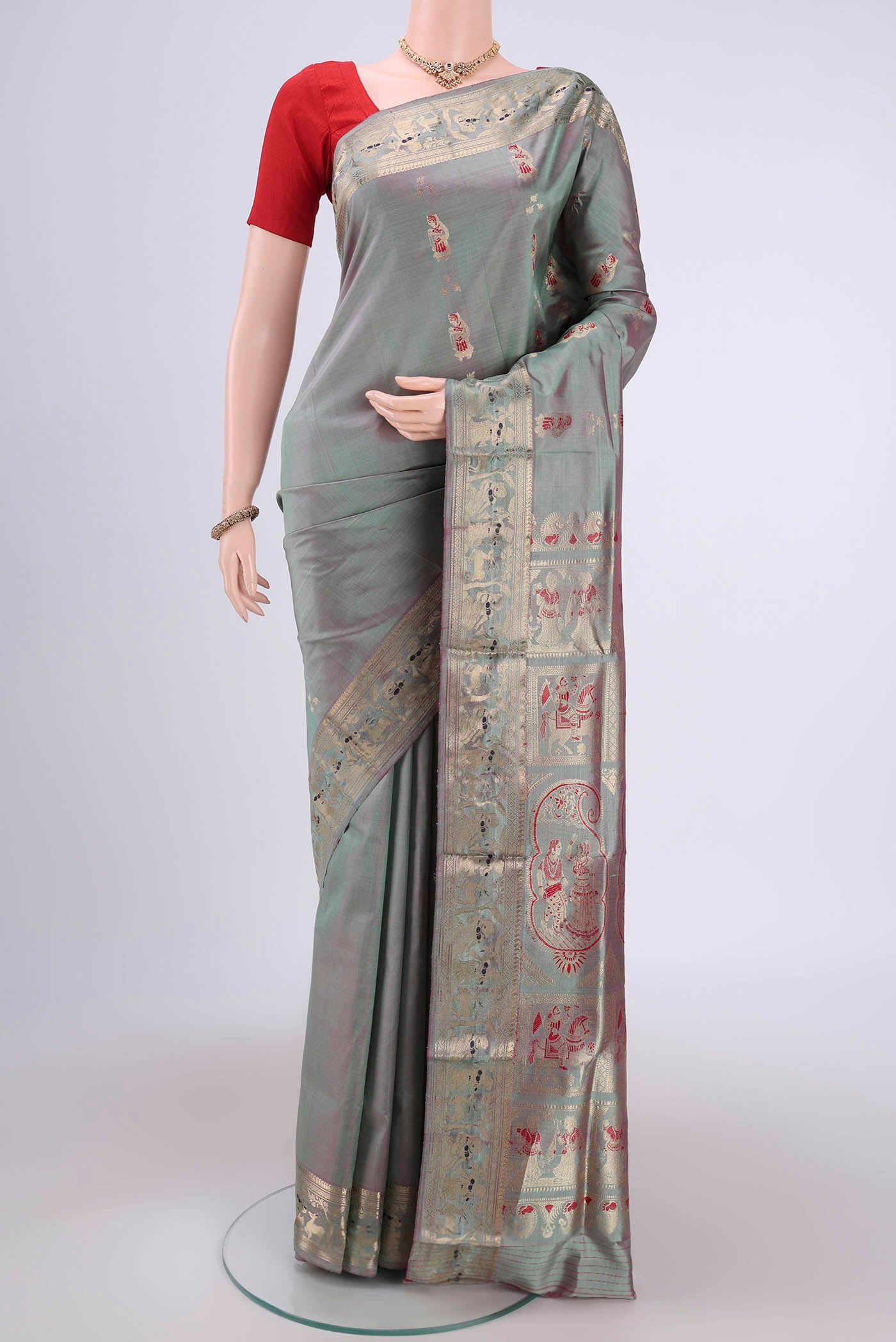 Grey Dual Tone Baluchari Silk Saree with Zari And Thread Butta on the body and Zari And Thread Border.  displayed on a mannequin