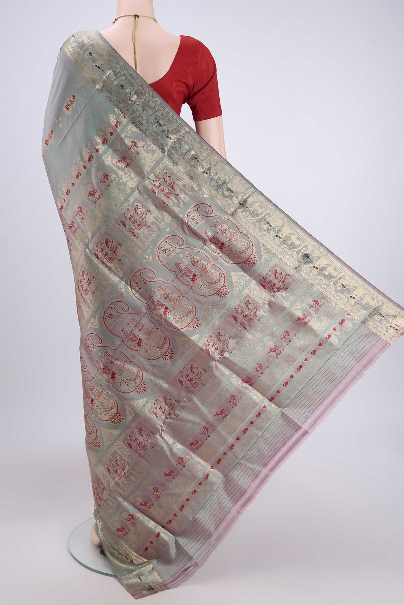 Flat view of Grey Dual Tone Baluchari Silk Saree with Zari And Thread Butta on the body and Zari And Thread Border. 