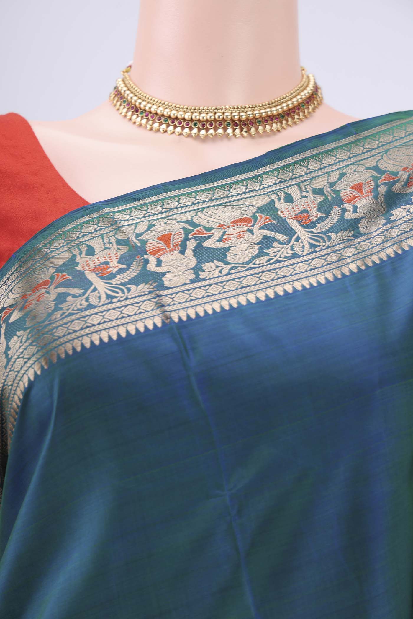 Border image of Peacock Blue Baluchari Silk Saree with Zari And Thread Butta on the body and Zari And Thread Border. 
