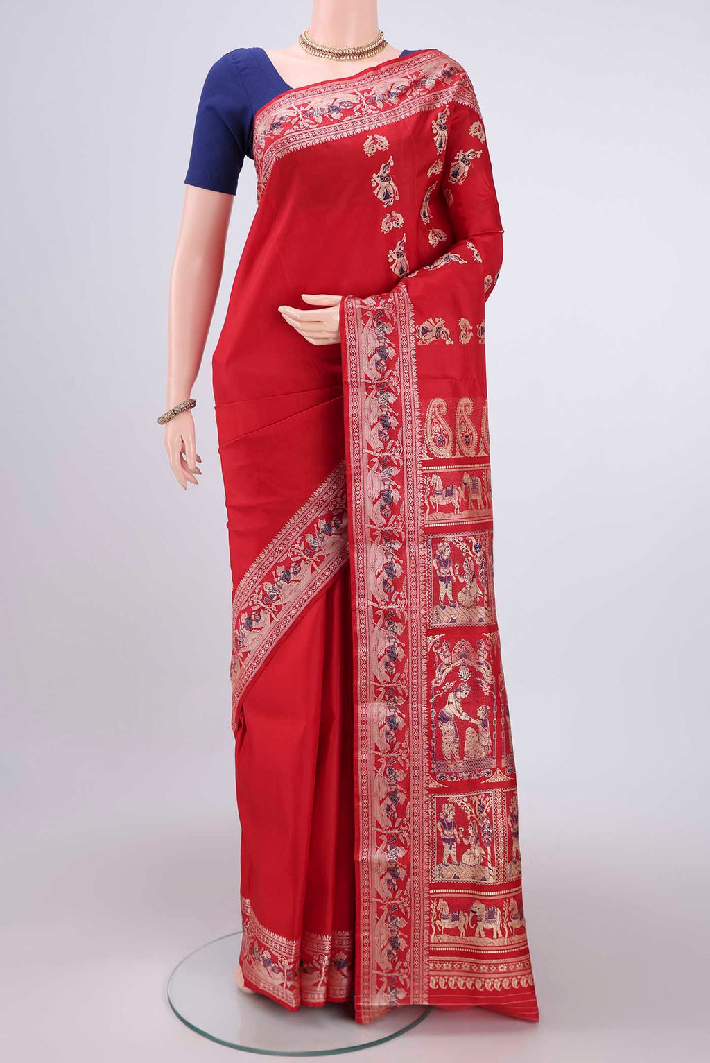 Red Baluchari Silk Saree with Thread Butta on the body and Thread Border.  displayed on a mannequin