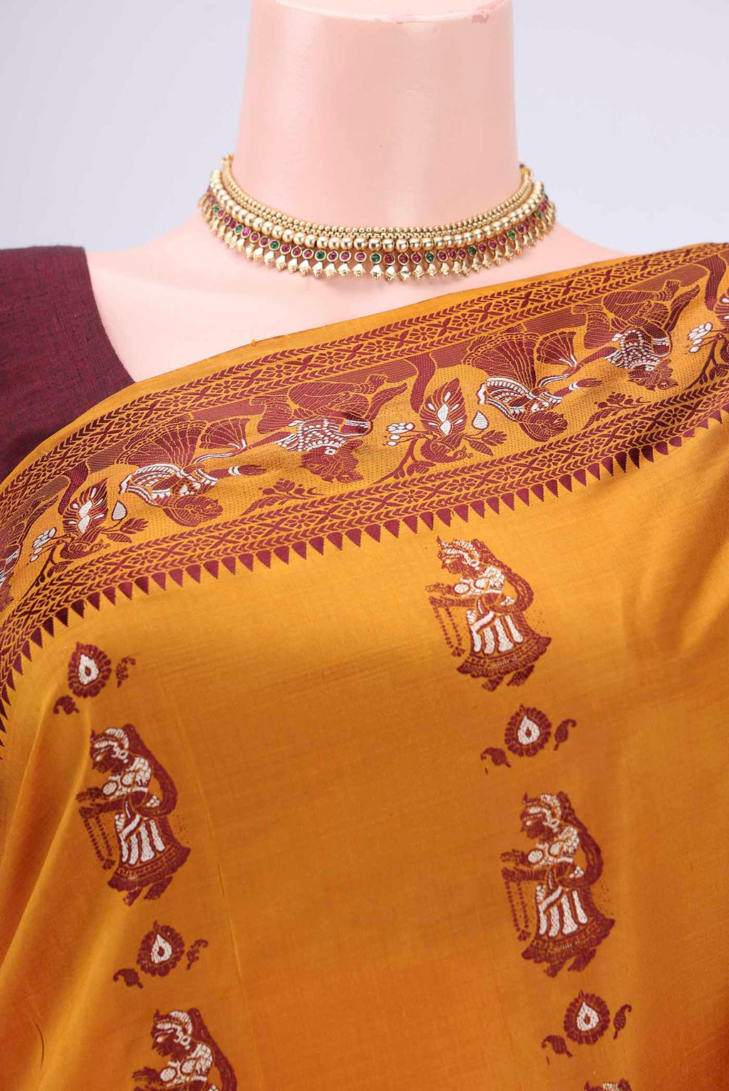 Border image of Mustard Baluchari Silk Saree with Thread Butta on the body and Thread Border. 