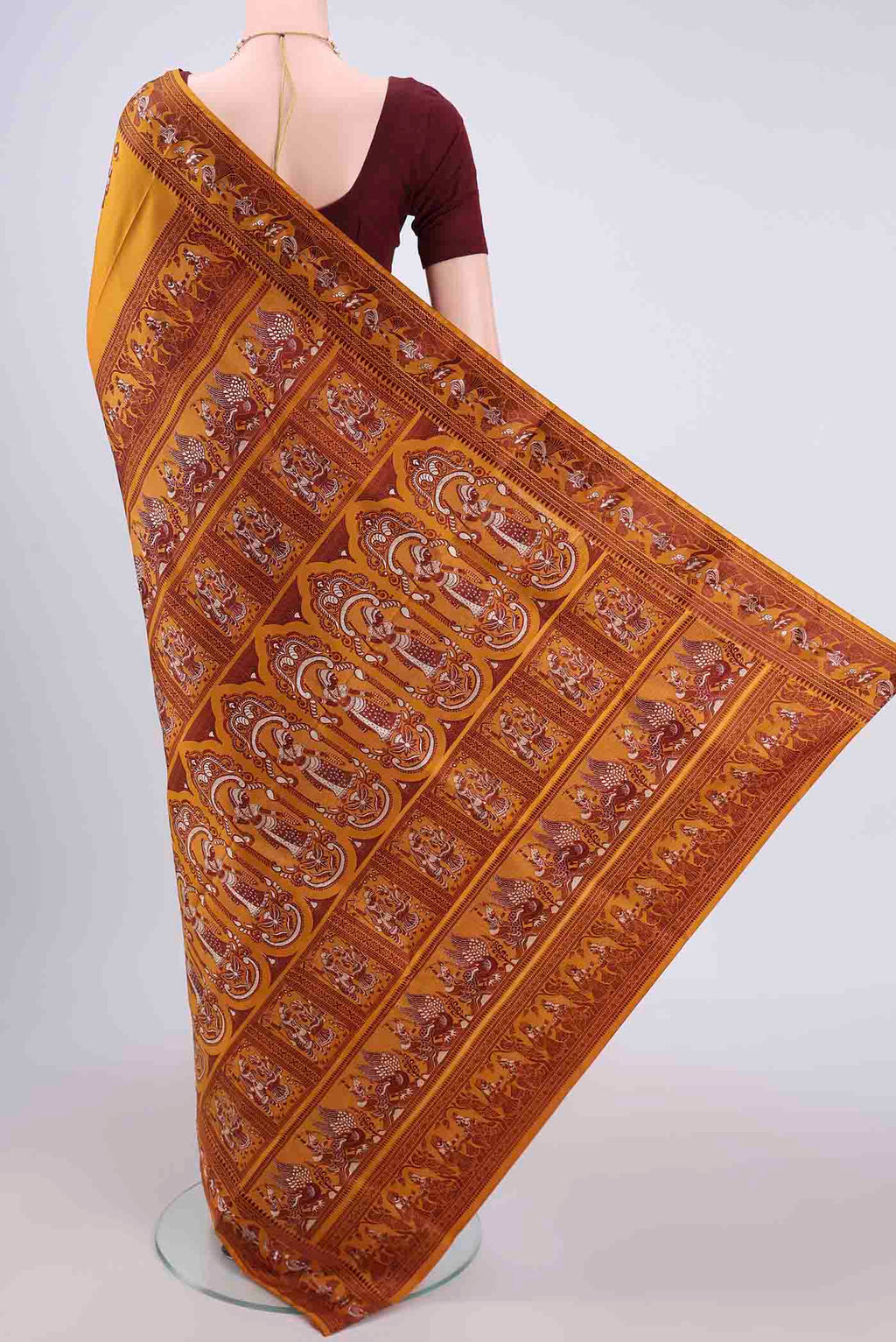 Flat view of Mustard Baluchari Silk Saree with Thread Butta on the body and Thread Border. 