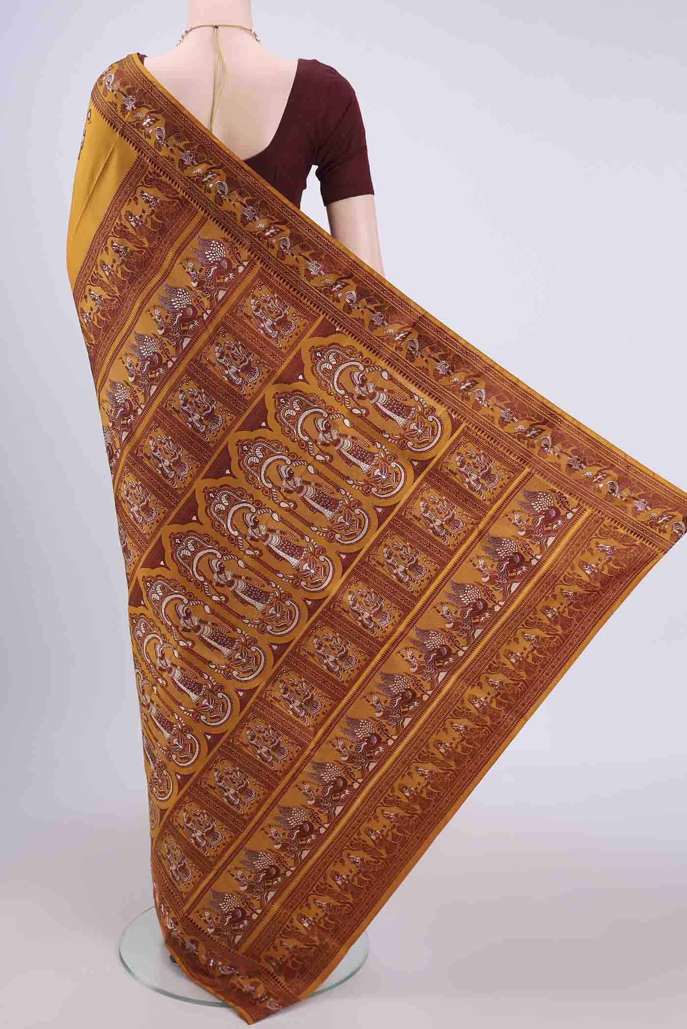 Flat view of Mustard Baluchari Silk Saree with Thread Butta on the body and Thread Border. 