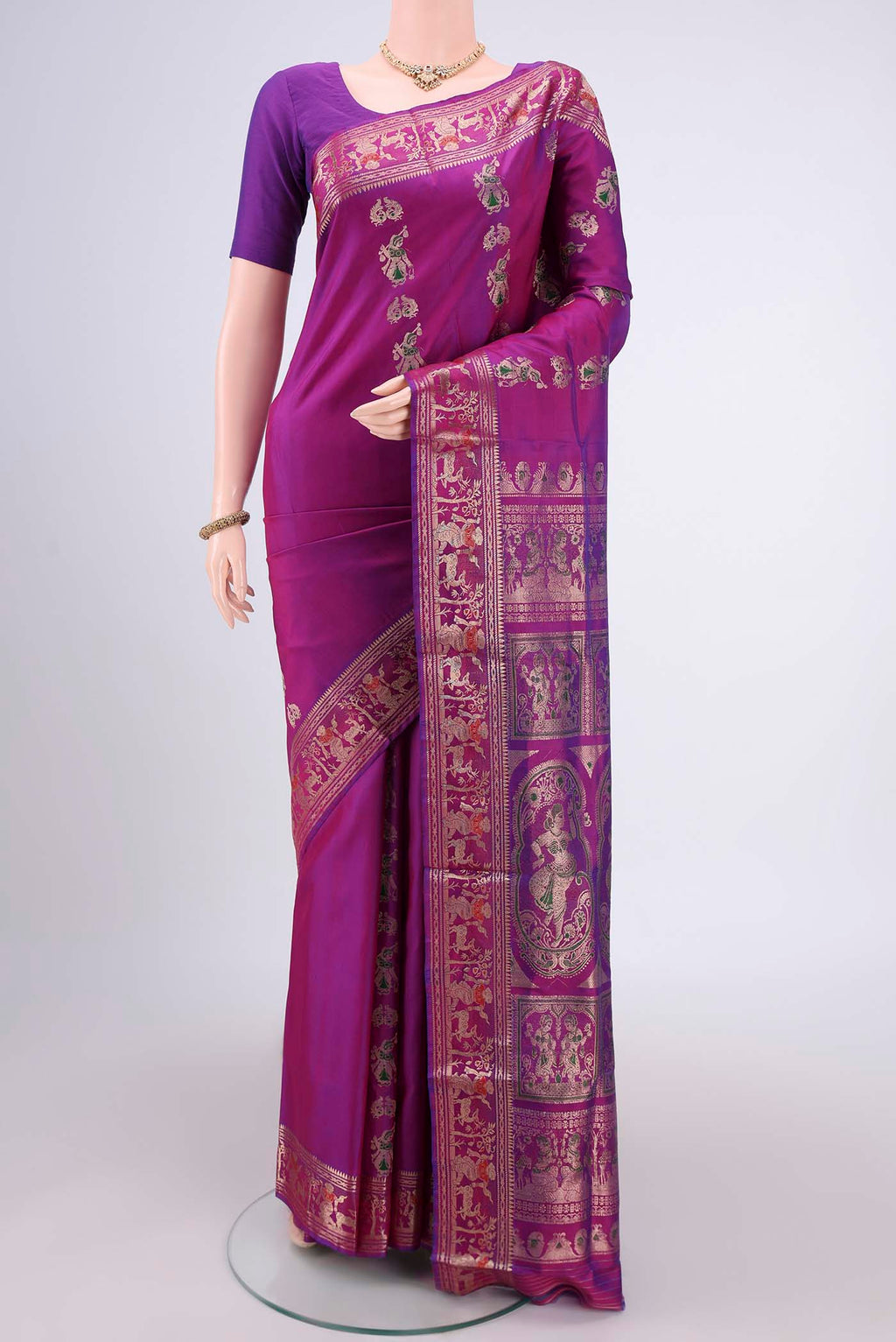 Purple Baluchari Silk Saree with Zari And Thread Butta on the body and Zari And Thread Border.  displayed on a mannequin