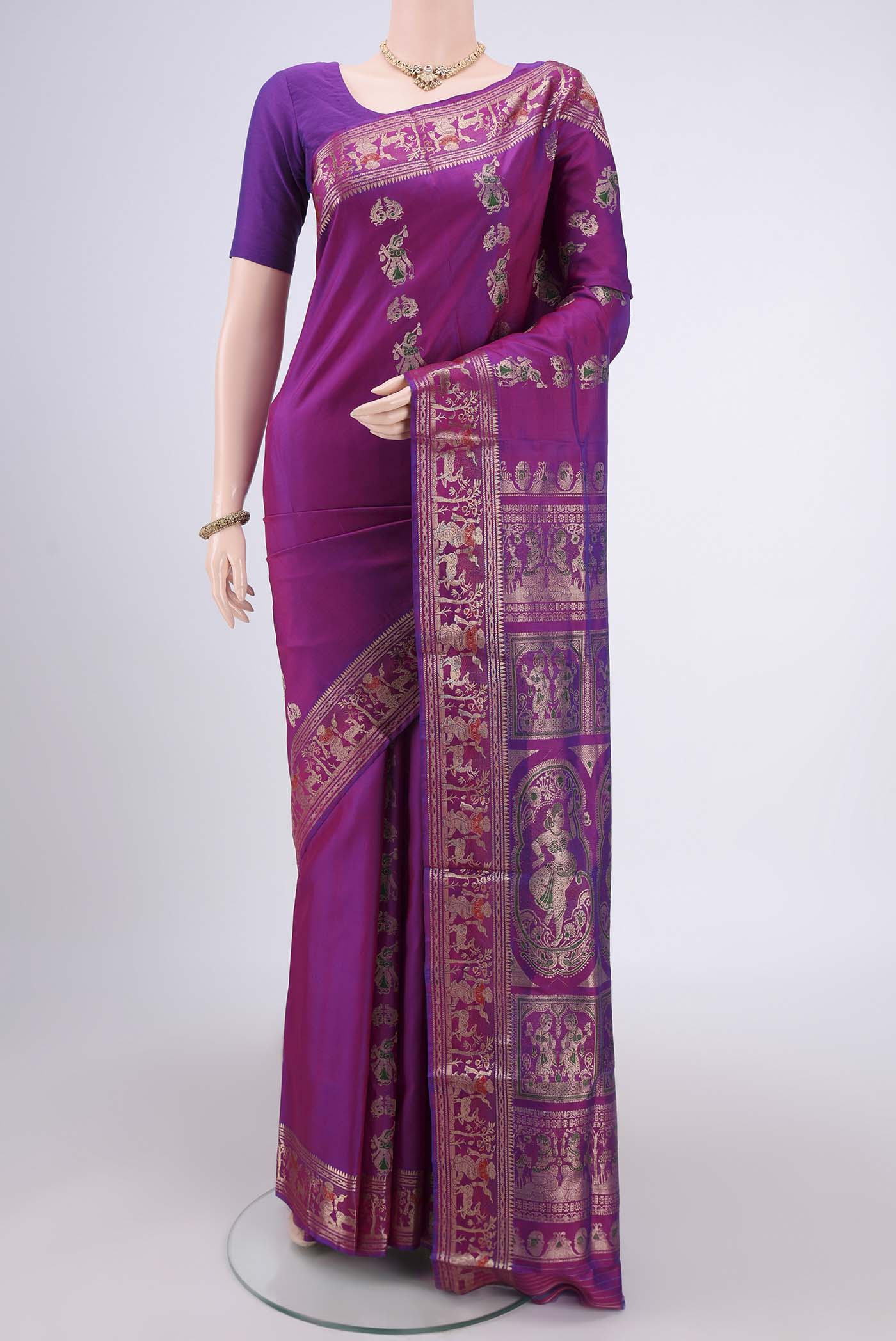 Purple Baluchari Silk Saree with Zari And Thread Butta on the body and Zari And Thread Border.  displayed on a mannequin
