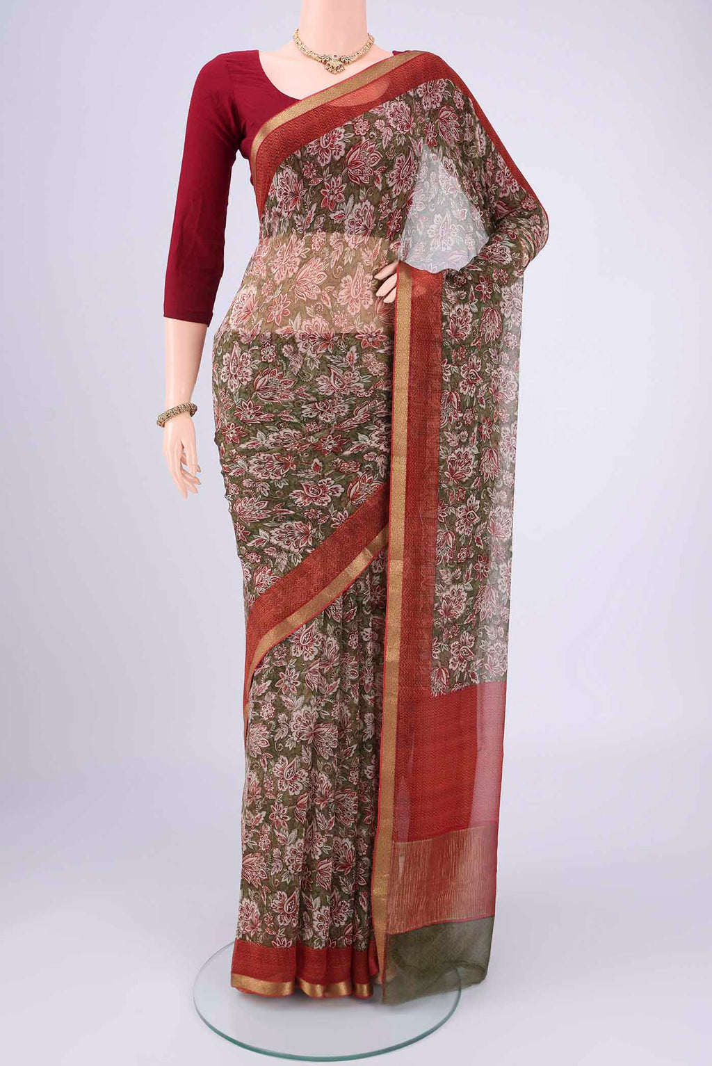 Mehandi Green Mysore Chiffon Saree with Floral Print on the body and Zari Border.  displayed on a mannequin