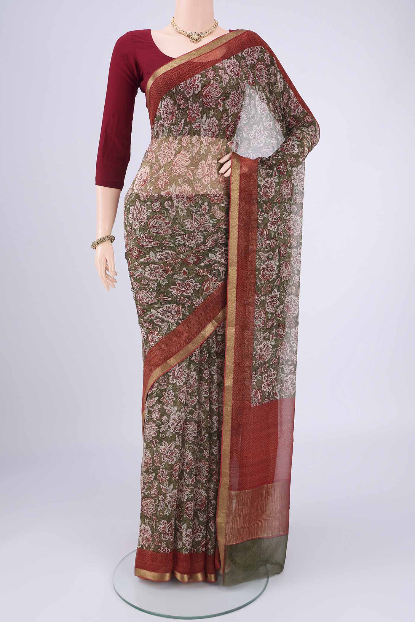 Mehandi Green Mysore Chiffon Saree with Floral Print on the body and Zari Border.  displayed on a mannequin