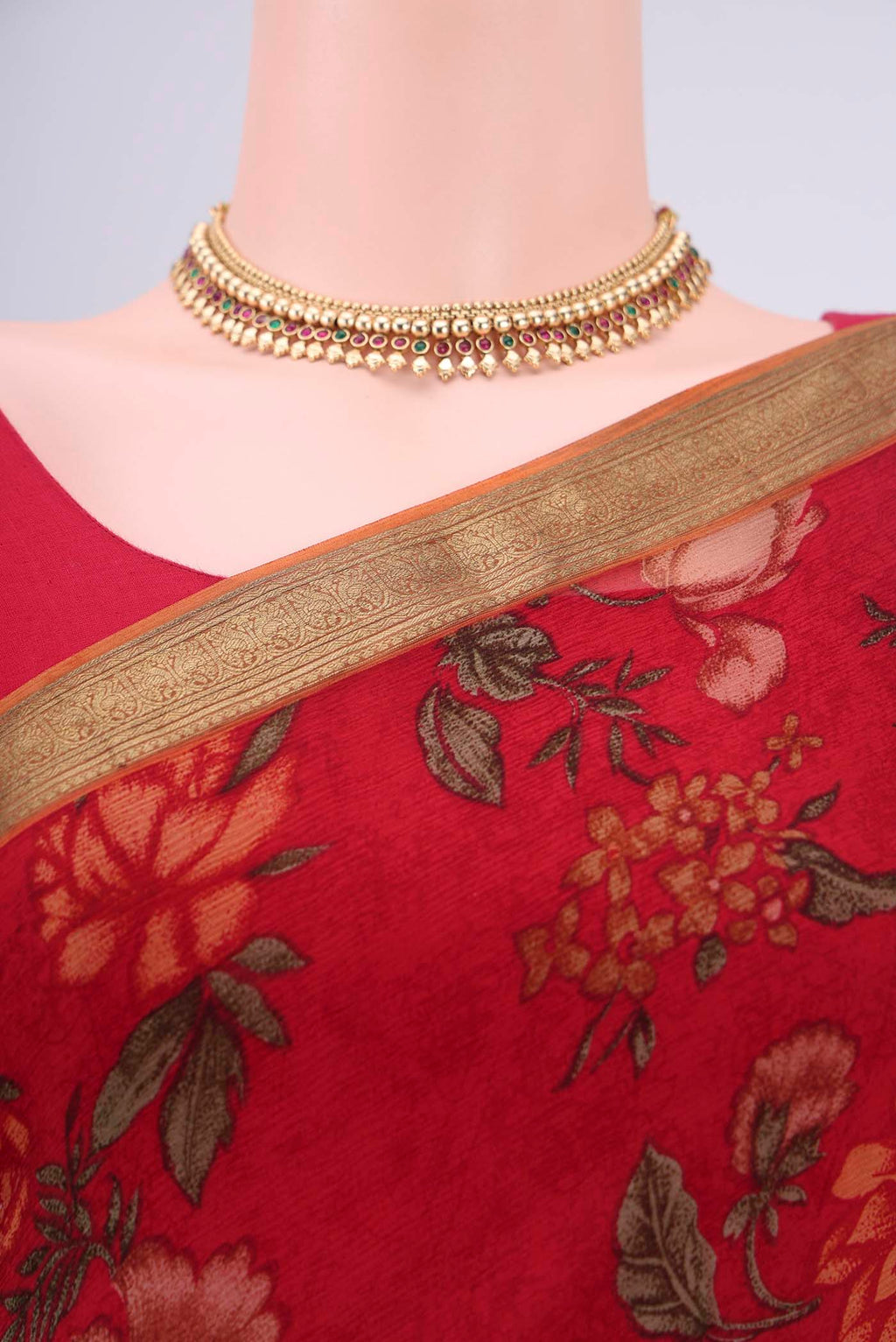 Border image of Red Mysore Chiffon Saree with Floral Print on the body and Zari Border. 