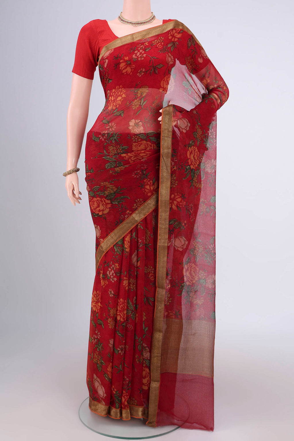 Red Mysore Chiffon Saree with Floral Print on the body and Zari Border.  displayed on a mannequin