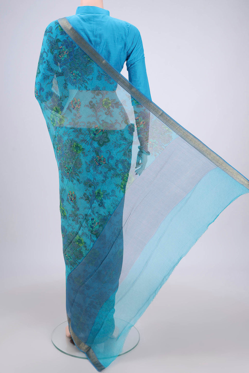 Flat view of Blue Mysore Chiffon Saree with Floral Print on the body and Zari Border. 