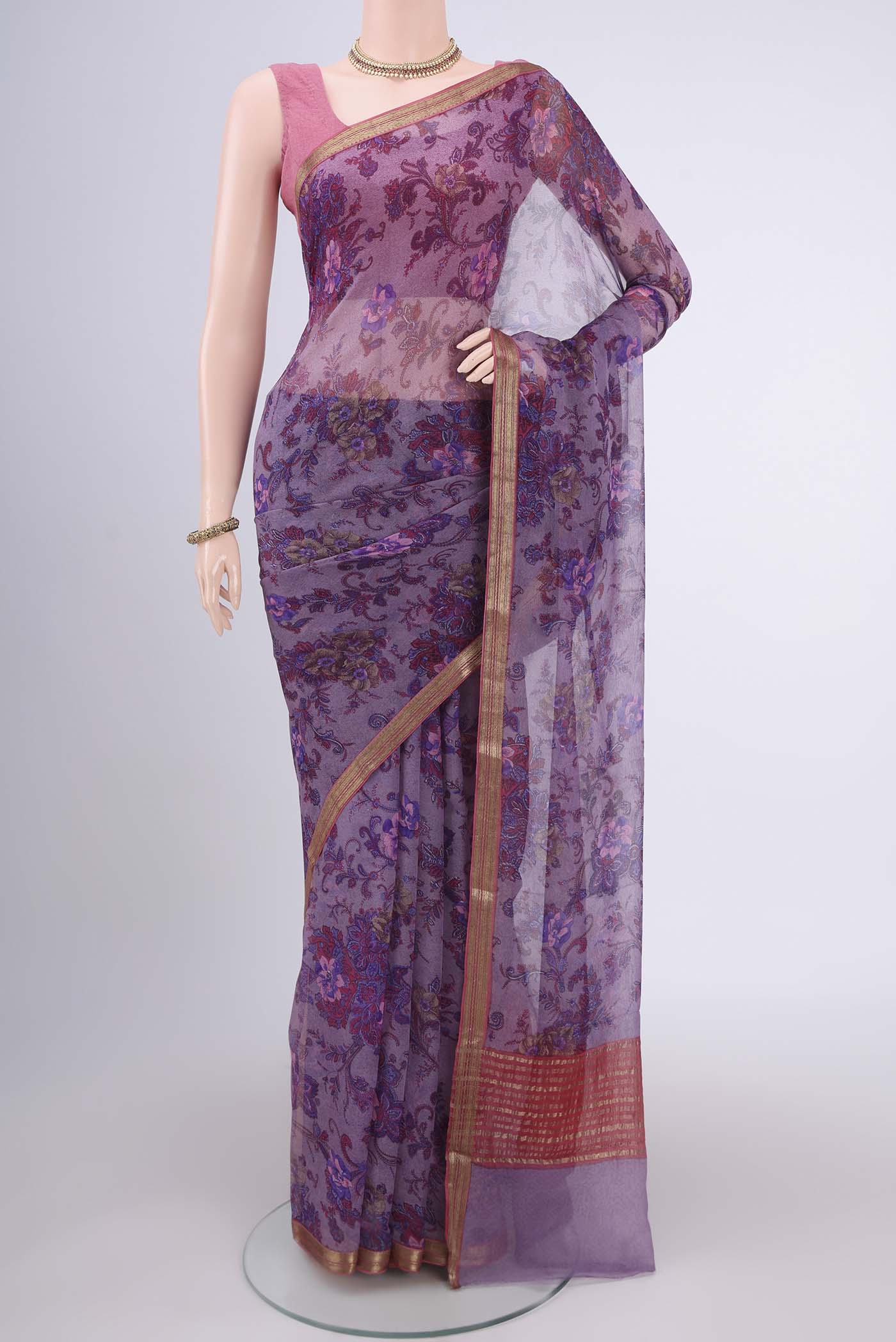 Mauve Mysore Chiffon Saree with Floral Print on the body and Zari Border.  displayed on a mannequin