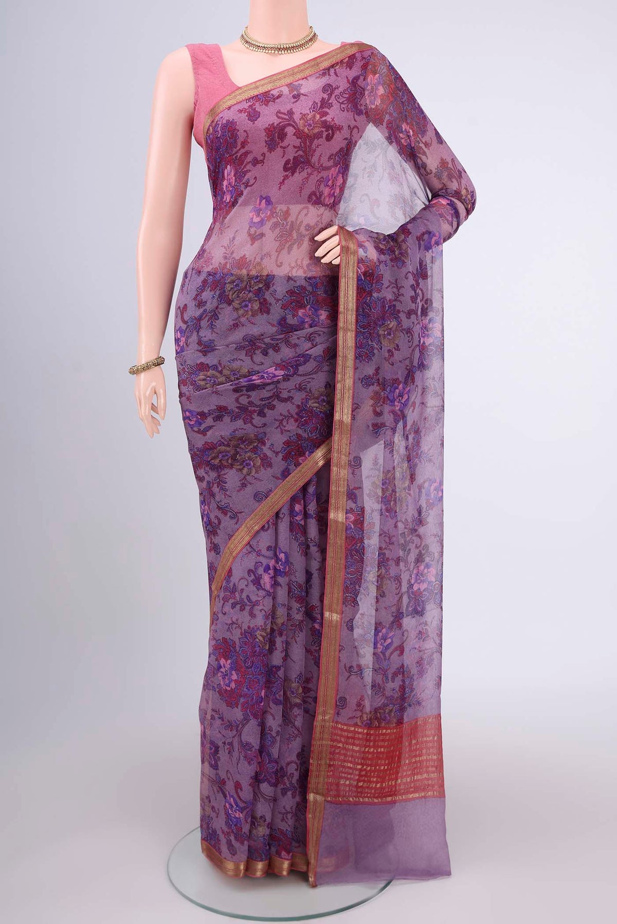 Mauve Mysore Chiffon Saree with Floral Print on the body and Zari Border.  displayed on a mannequin