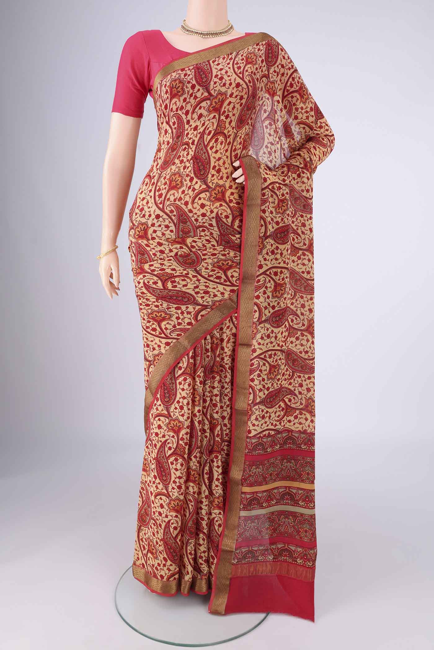 Sandal Mysore Crepe Saree with Printed design on the body and Zari Border.  displayed on a mannequin