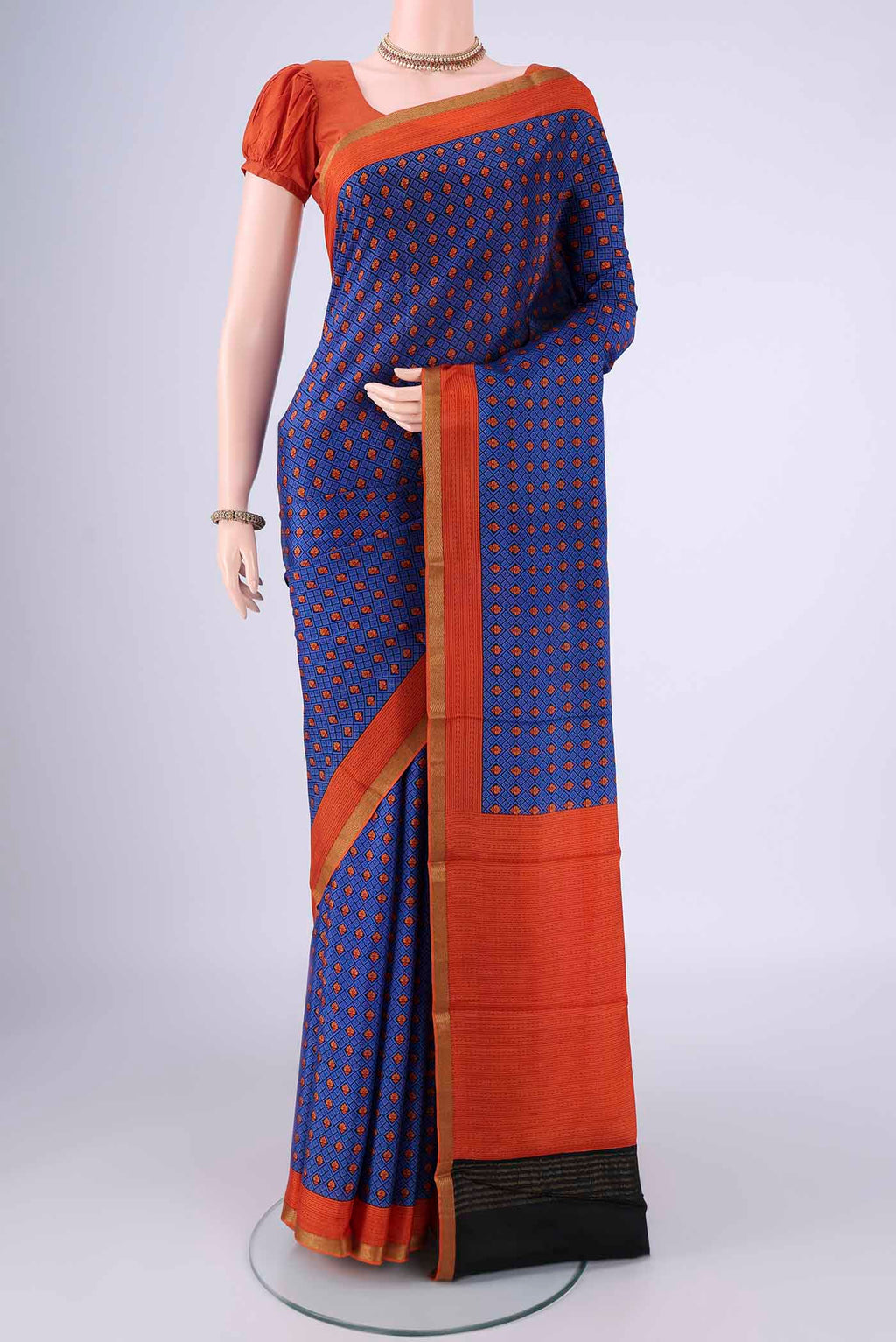 Royal Blue Mysore Crepe Saree with Printed design on the body and Printed Border.  displayed on a mannequin