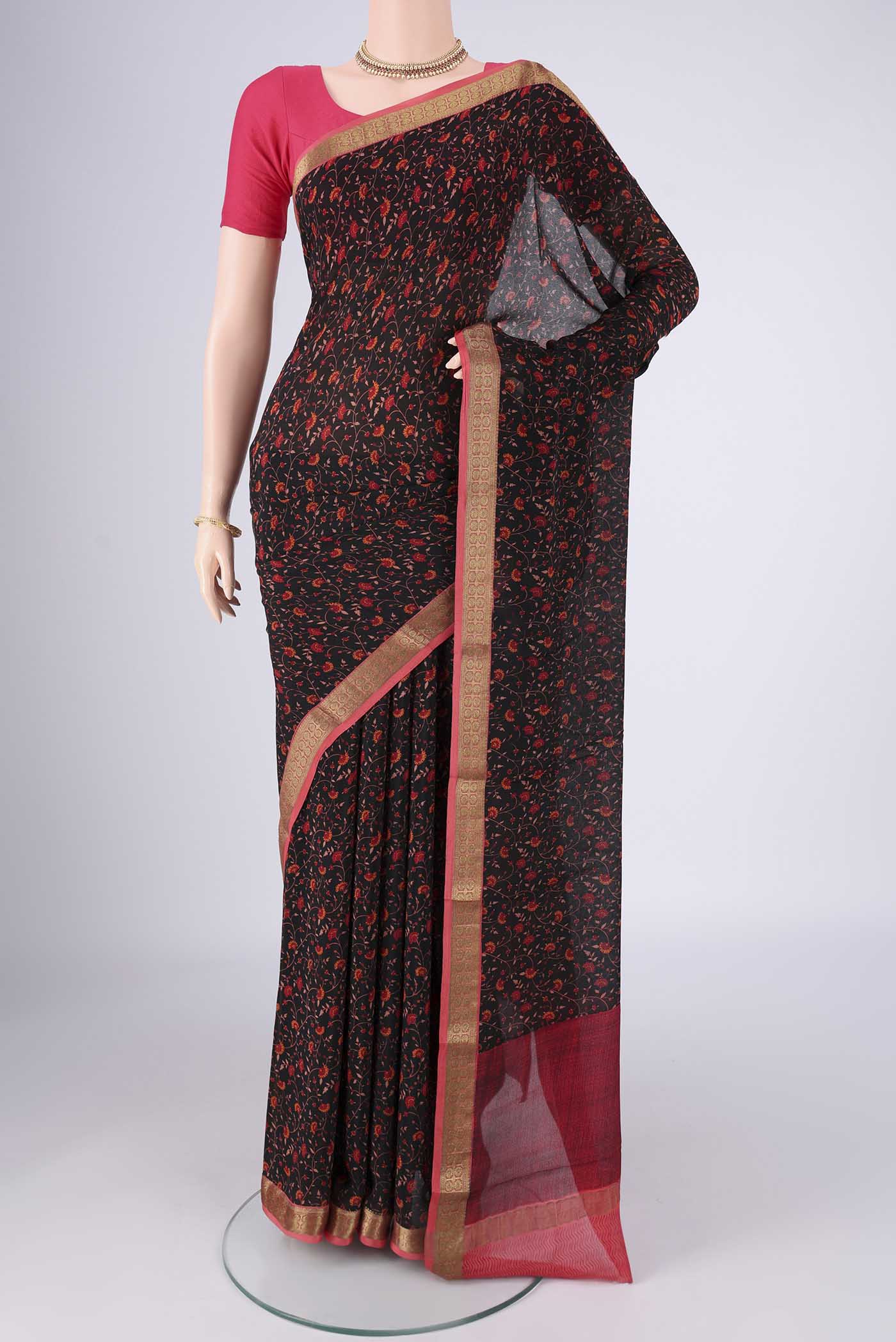 Black Mysore Crepe Saree with Printed design on the body and Zari Border.  displayed on a mannequin