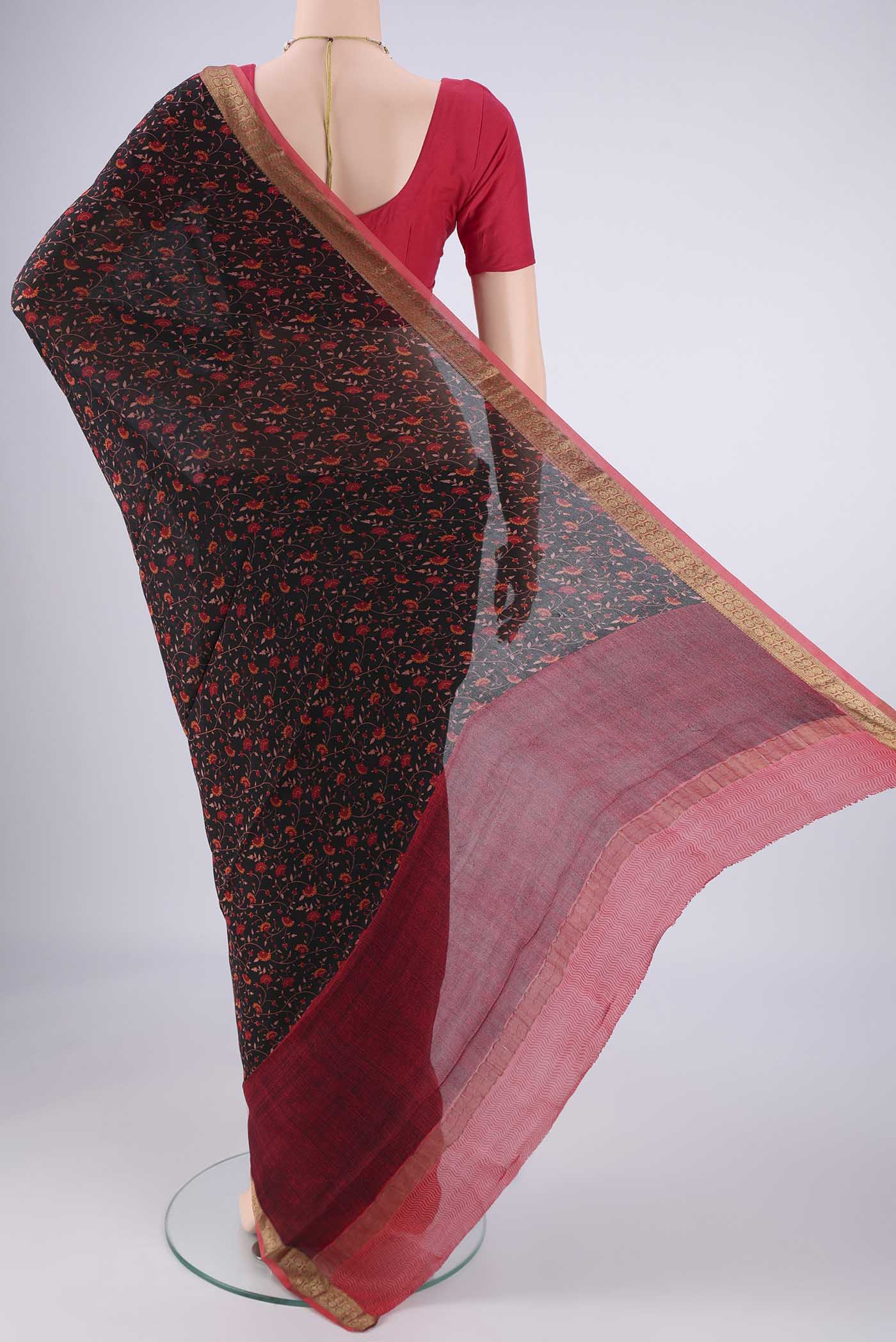 Flat view of Black Mysore Crepe Saree with Printed design on the body and Zari Border. 