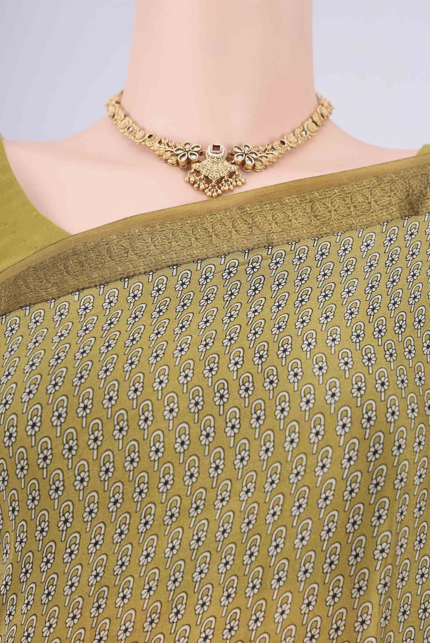 Border image of Mehandi Green Mysore Crepe Saree with Printed design on the body and Zari Border. 