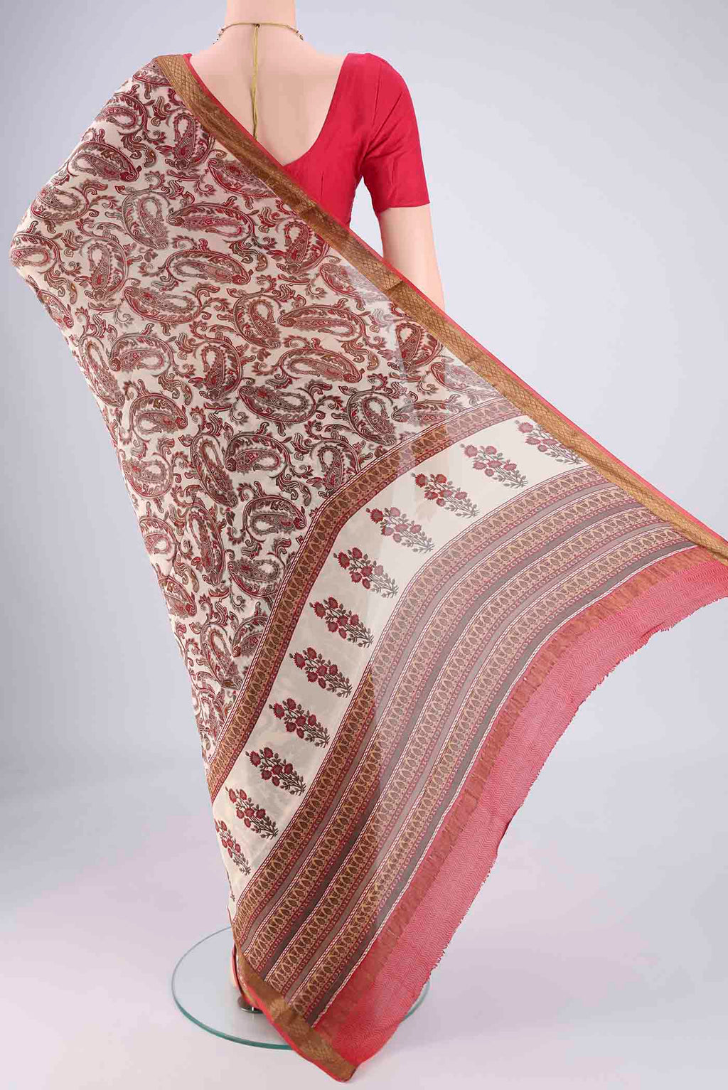 Flat view of Off White Mysore Crepe Saree with Printed design on the body and Zari Border. 