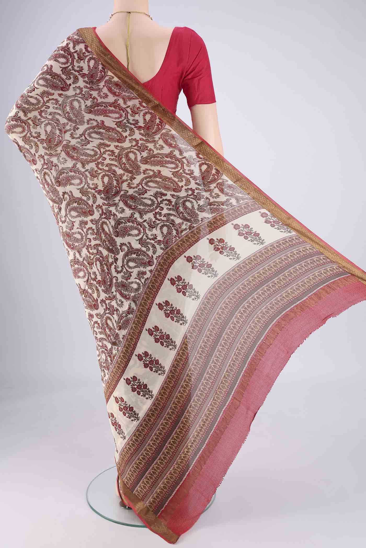 Flat view of Off White Mysore Crepe Saree with Printed design on the body and Zari Border. 
