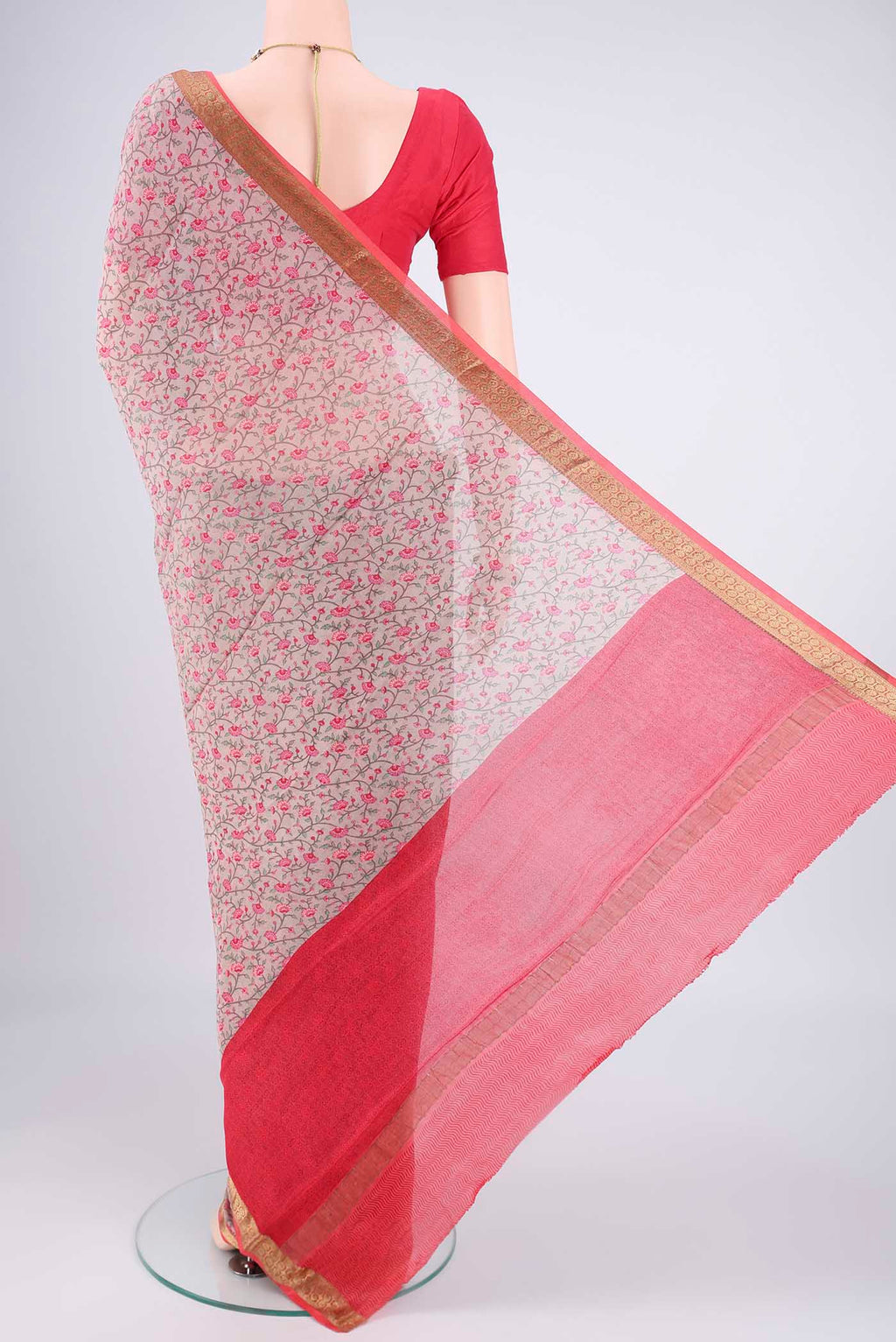 Flat view of Grey Mysore Crepe Saree with Printed design on the body and Zari Border. 