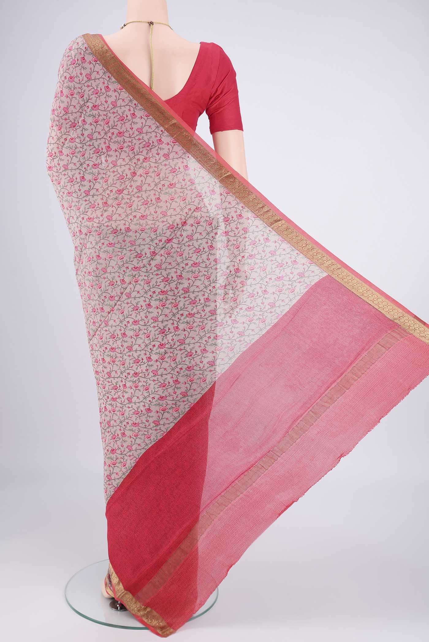 Flat view of Grey Mysore Crepe Saree with Printed design on the body and Zari Border. 