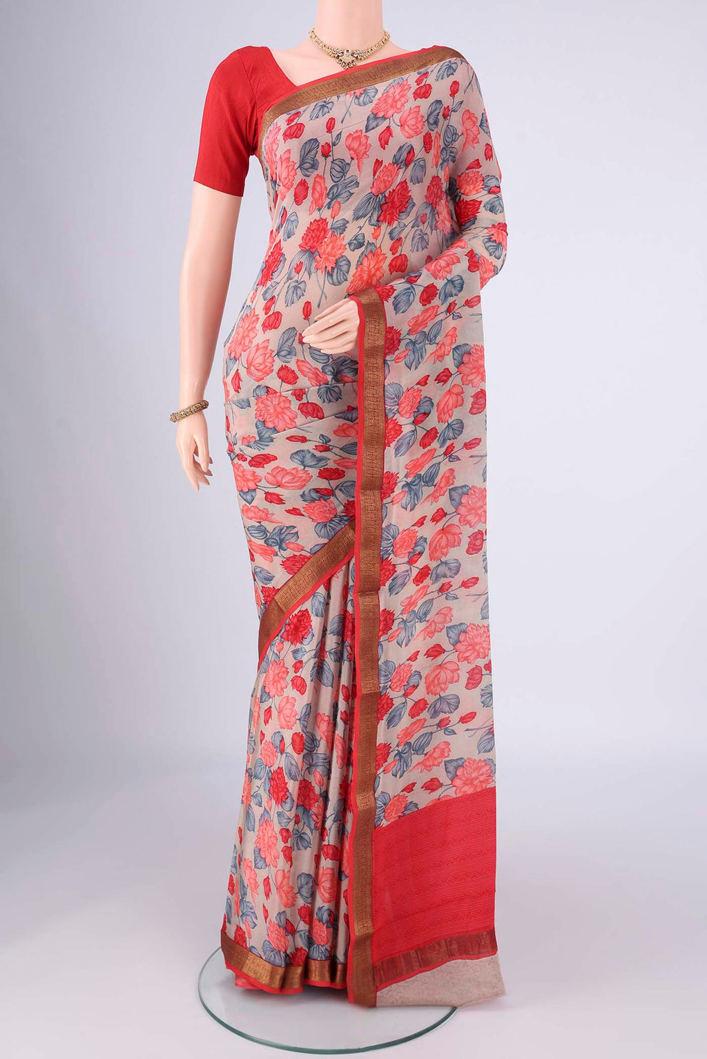 Grey Mysore Crepe Saree with Printed design on the body and Zari Border.  displayed on a mannequin