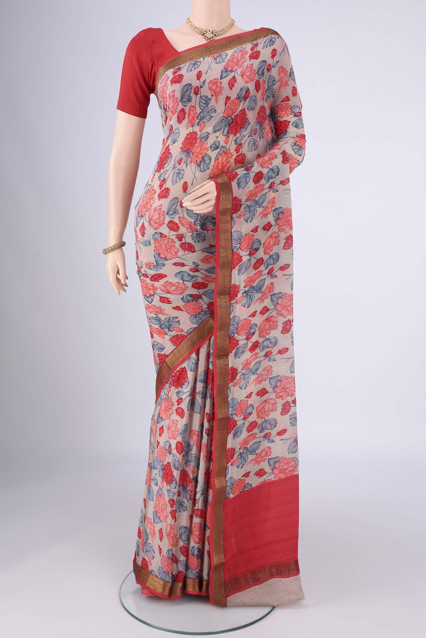 Grey Mysore Crepe Saree with Printed design on the body and Zari Border.  displayed on a mannequin