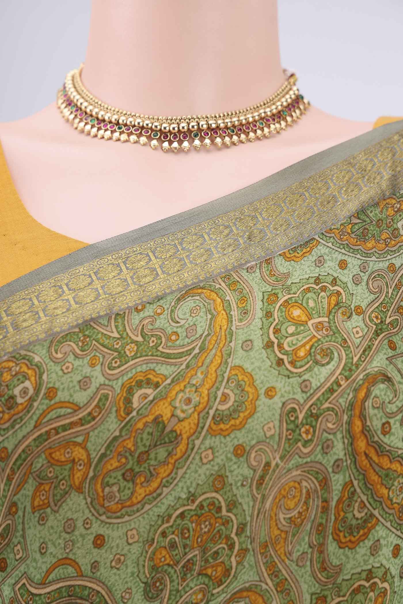 Border image of Light Green Mysore Crepe Saree with Floral Print on the body and Zari Border. 