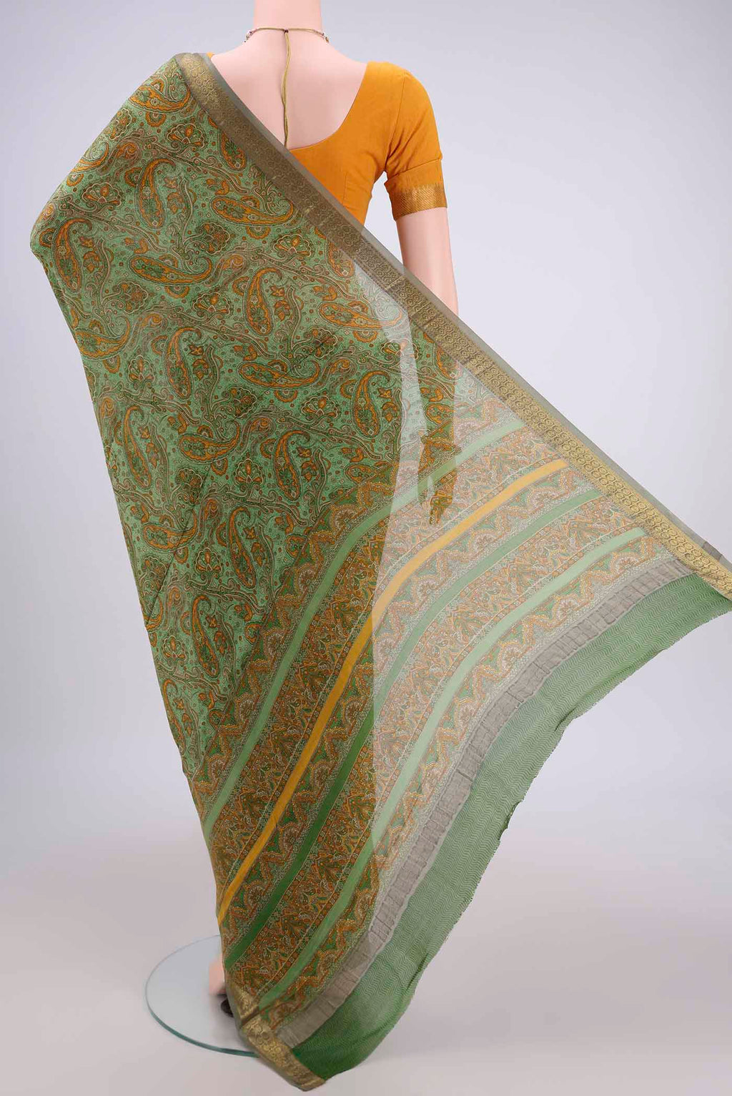 Flat view of Light Green Mysore Crepe Saree with Floral Print on the body and Zari Border. 