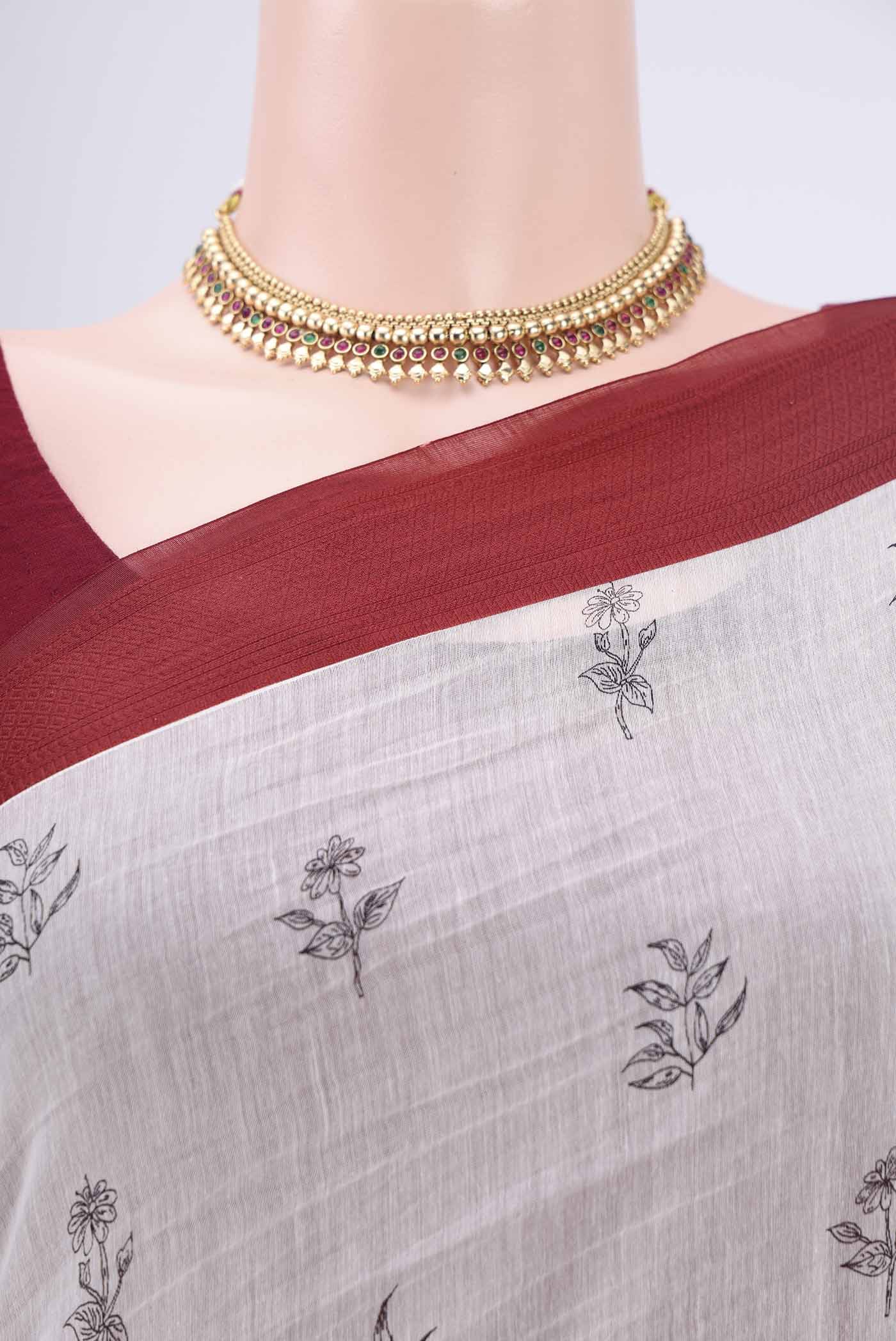Border image of White Silk Cotton Saree with Printed design on the body and Plain Border. 