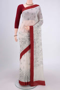 White Silk Cotton Saree with Printed design on the body and Plain Border.  displayed on a mannequin
