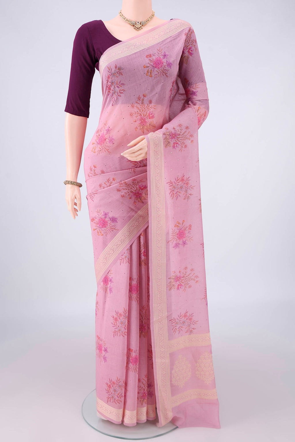 Rose pink Chanderi Cotton Saree with Printed design on the body and Thread Border.  displayed on a mannequin