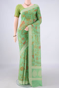 Light Green Chanderi Cotton Saree with Printed design on the body and Thread Border.  displayed on a mannequin