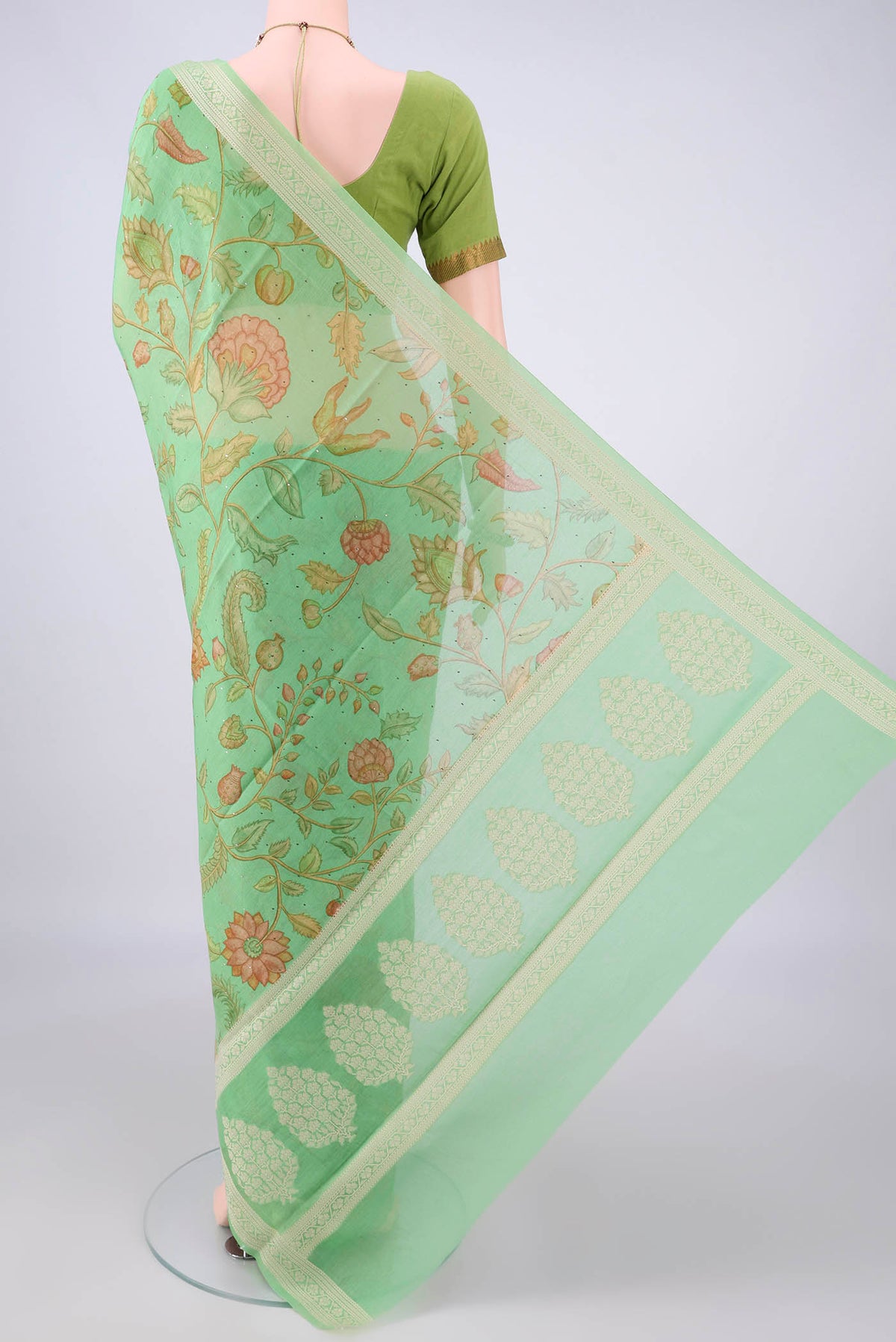 Flat view of Light Green Chanderi Cotton Saree with Printed design on the body and Thread Border. 