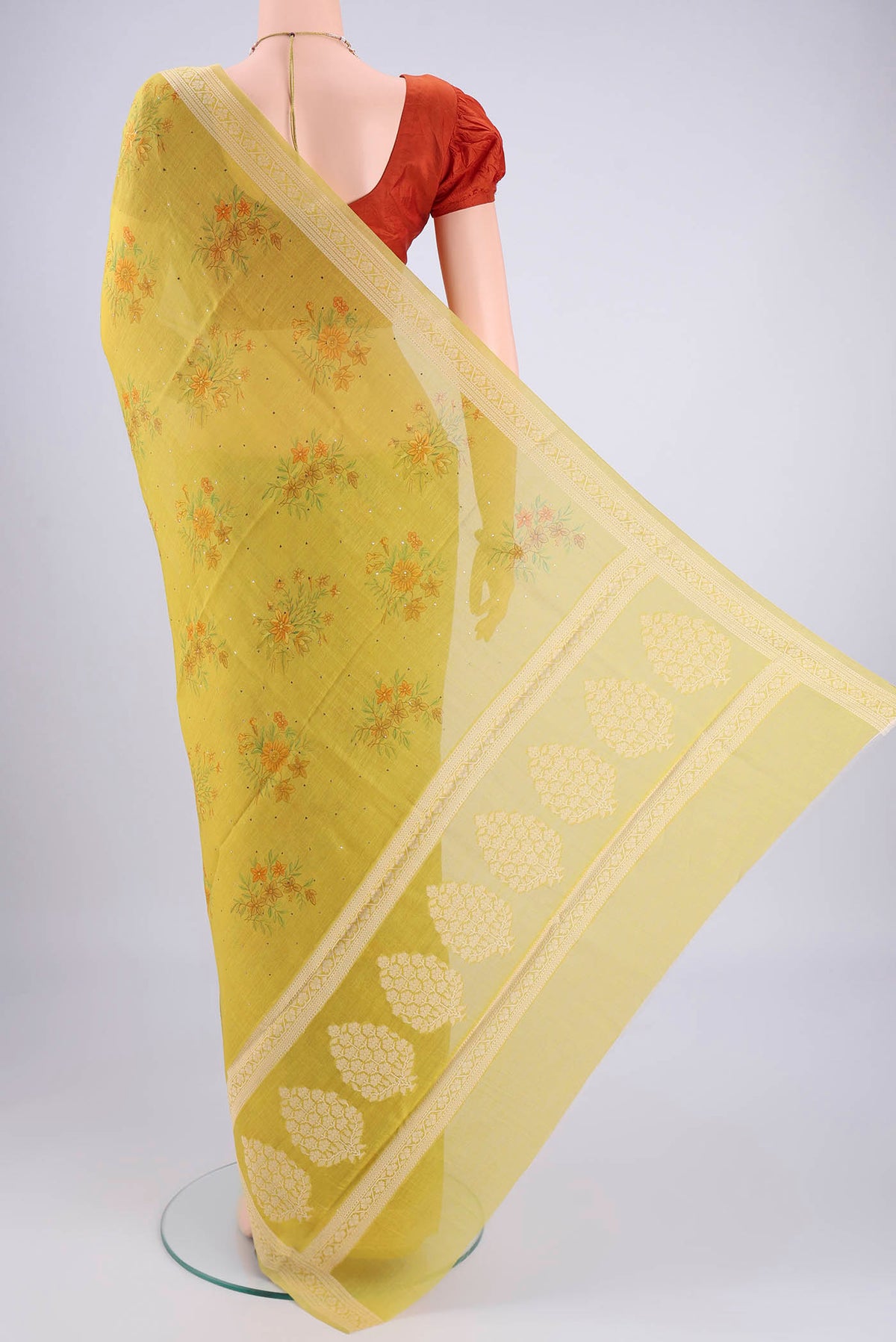 Flat view of Acid Green Chanderi Silk Cotton Saree with Floral Print on the body and Zari Border. 