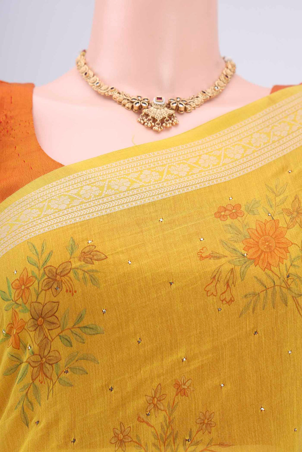 Border image of Yellow Chanderi Silk Saree with Printed design on the body and Thread Border. 